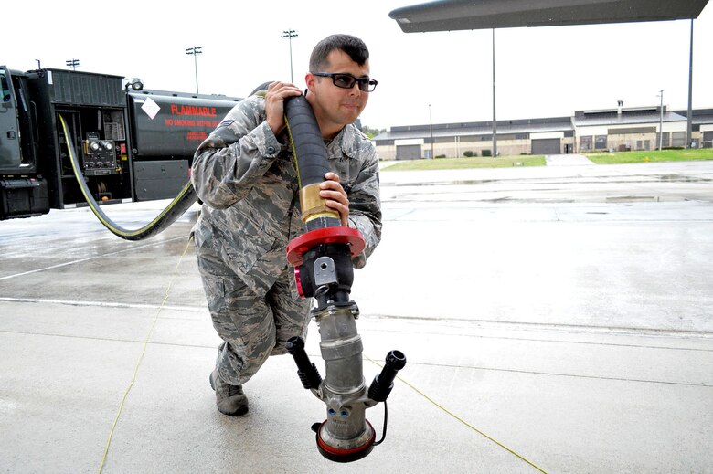 Air Force Airman 1st Class Kyle King, a fuels distribution operator from the 43rd Logistics Readiness Squadron, Pope Army Airfield, N.C., prepares to refuel a C-130J Super Hercules aircraft from the 317th Airlift Group, Dyess AFB, Texas, on Apr. 16, 2015, during Combined Joint Operational Access Exercise 15-01. CJOAX 15-01 is an 82nd Airborne Division-led bilateral training event at Fort Bragg, N.C., from April 13-20, 2015. This is the
largest exercise of its kind held at Fort Bragg in nearly 20 years and demonstrates interoperability between U.S. and U.K. Army soldiers and U.S. Air Force, Air National Guard, Royal Air Force Airmen and U.S. Marines. (U.S. Air Force photo/Marvin Krause)
