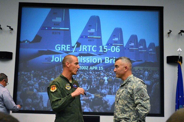 Air Force Col. Jeffrey Brown, Combined Joint Operational Access Exercise 15-01 air mission commander and 317th Airlift Group commander, Dyess AFB, Texas, left, discusses exercise planning with Army Col. Anthony Judge, 82nd Airborne Division operations officer, during a CJOAX joint mission briefing on Apr. 15, 2015, Pope Army Airfield, N.C. CJOAX 15-01 is an 82nd Airborne Division-led bilateral training event at Fort Bragg, N.C., from April 13-20, 2015. This is the largest exercise of its kind held at Fort Bragg in nearly 20 years and demonstrates interoperability between U.S. and U.K. Army
soldiers and U.S. Air Force, Air National Guard, Royal Air Force Airmen and U.S. Marines. (U.S. Air Force photo/Marvin Krause)
