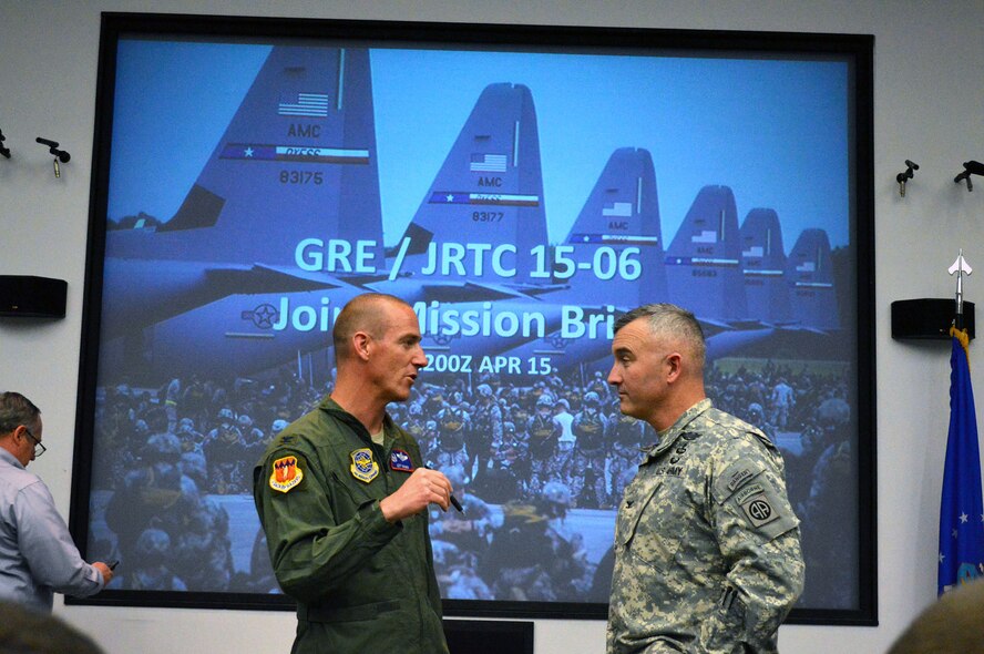 Air Force Col. Jeffrey Brown, Combined Joint Operational Access Exercise 15-01 air mission commander and 317th Airlift Group commander, Dyess AFB, Texas, left, discusses exercise planning with Army Col. Anthony Judge, 82nd Airborne Division operations officer, during a CJOAX joint mission briefing on Apr. 15, 2015, Pope Army Airfield, N.C. CJOAX 15-01 is an 82nd Airborne Division-led bilateral training event at Fort Bragg, N.C., from April 13-20, 2015. This is the largest exercise of its kind held at Fort Bragg in nearly 20 years and demonstrates interoperability between U.S. and U.K. Army
soldiers and U.S. Air Force, Air National Guard, Royal Air Force Airmen and U.S. Marines. (U.S. Air Force photo/Marvin Krause)
