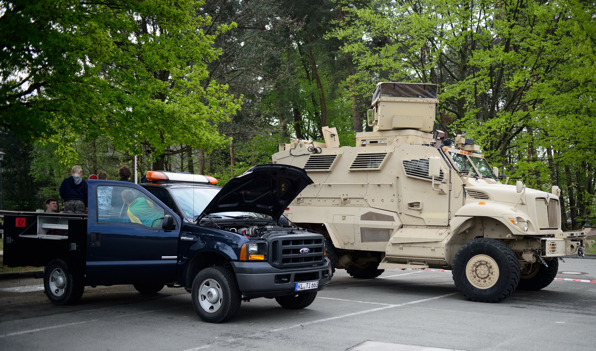 Children from Ramstein Intermediate School explore the vehicles of the 86th Vehicle Readiness Squadron April 28, 2015, at Ramstein Air Base, Germany. The 86th VRS Airmen were just one of the few careers showcased during the RIS Career Day. (U.S. Air Force photo/Staff Sgt. Armando A. Schwier-Morales) 