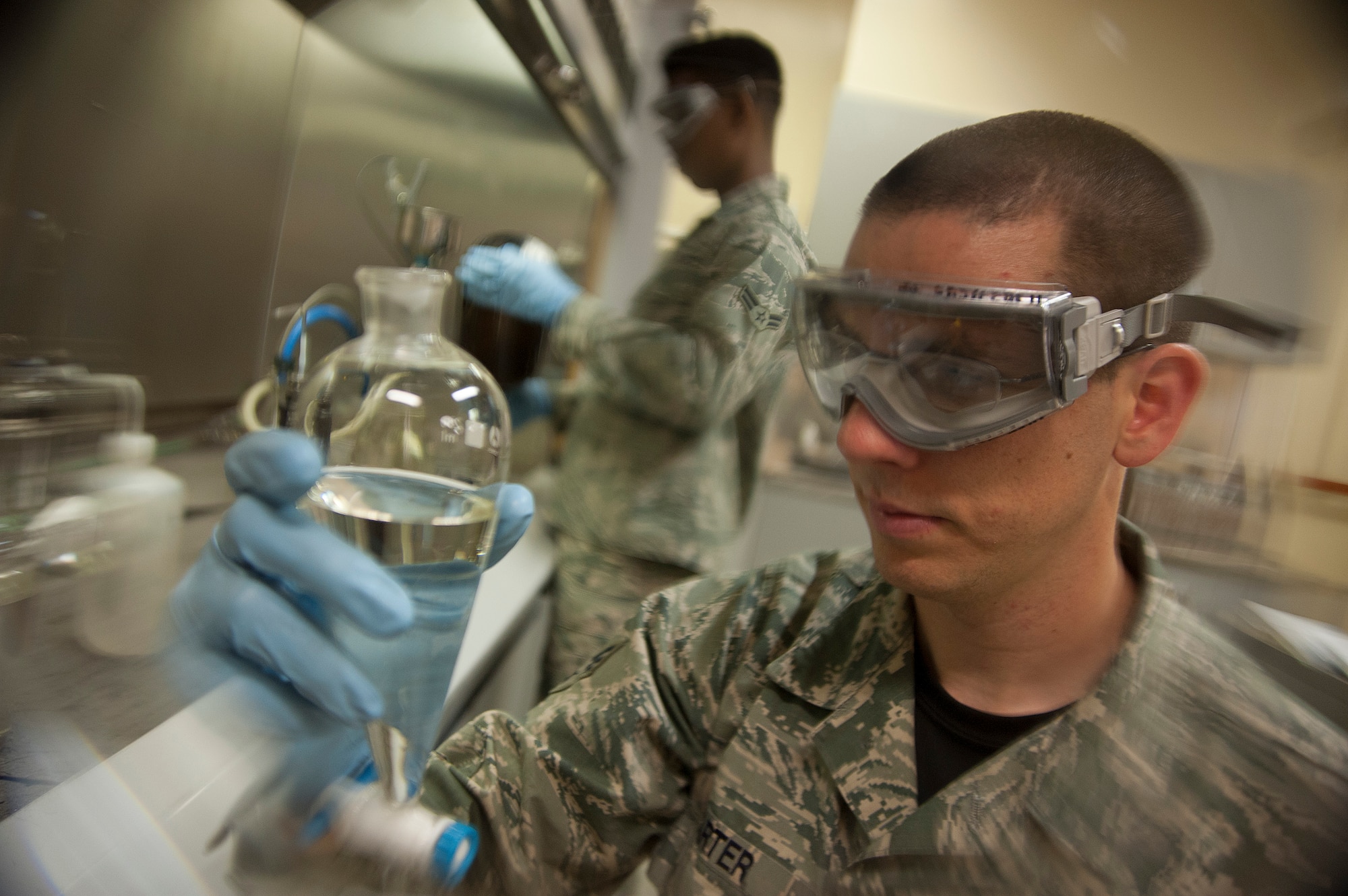 U.S. Air Force Senior Airman Brett Carter, 35th Logistics Readiness Squadron fuels laboratory technician, visually inspects a fuel sample before conducting a Fuel System Icing Inhibitor Test at Misawa Air Base, Japan, May 1, 2015. This test measures proper amounts of FSII, which is used to prevent the formation of ice in the fuel lines. As aircraft reach higher altitudes, the fuel lines have the potential to freeze over and cause malfunction in fuel system. Lab technicians conduct the test to ensure the fuel is able to adequately work in those lower temperatures. (U.S. Air Force photo by Senior Airman Jose L. Hernandez-Domitilo/ Released) 