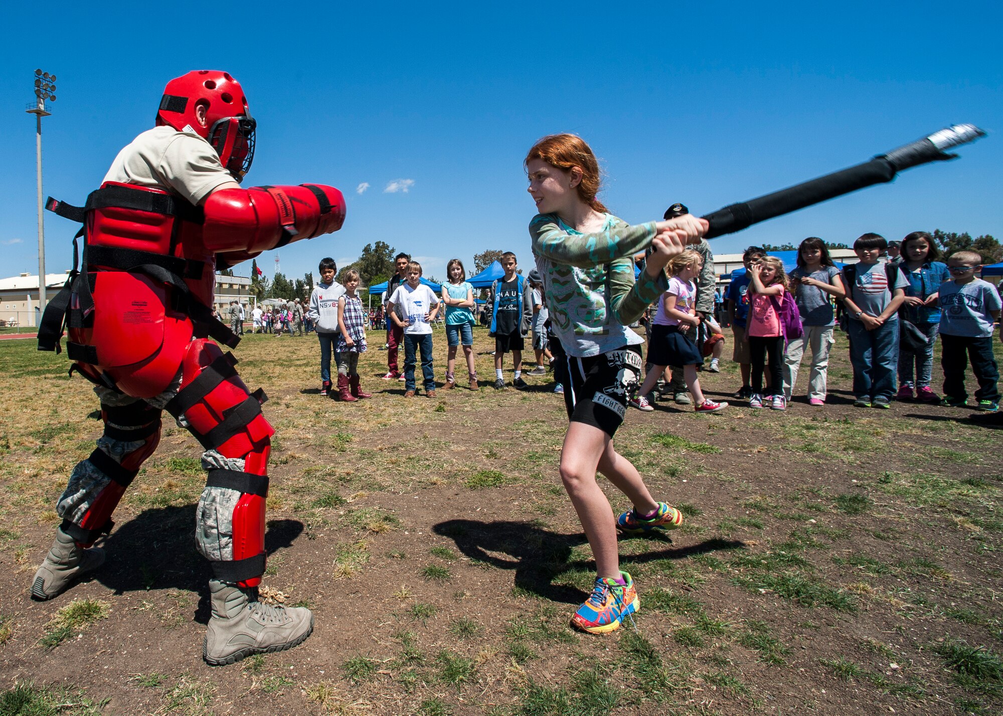Kassey, 39th Air Base Wing dependent, participates in combative techniques with Airman 1st Class Nicholas Lodge, 39th Security Forces Squadron security response team member, during a Job Shadow event April 24, 2015, at Incirlik Air Base, Turkey. The dependents also got to interact with 11 different units on base during a bus tour. (U.S. Air Force photo by Airman 1st Class Cory W. Bush/Released)