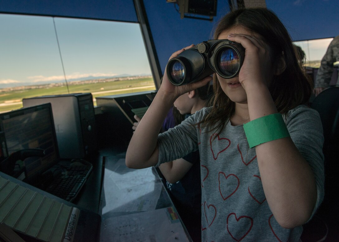 Taylor, 39th Air Base Wing dependent, looks upon the flight line with a pair of binoculars from the 39th Operations Support Squadron air traffic control tower during the 2015 Job Shadow Day April 24, 2015, at Incirlik AB, Turkey. The 39th OSS was one of the stops during the bus tour, along with the 39th Maintenance Squadron and 39th Communications Squadron. (U.S. Air Force photo by Airman 1st Class Cory W. Bush/Released)