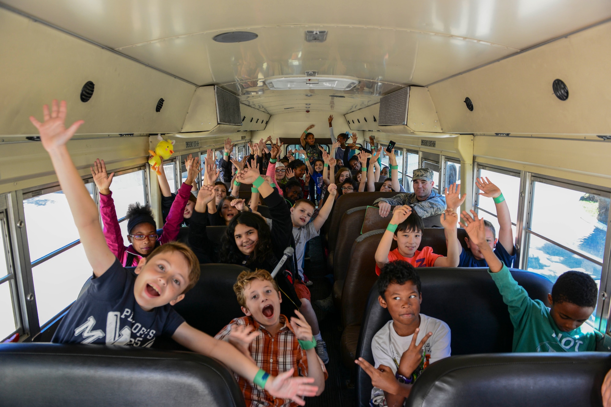 Dependents from the 39th Air Base Wing pose for a group photo during the 2015 Job Shadow Day April 24, 2015, at Incirlik Air Base, Turkey. The event gave children the opportunity to observe a myriad of military and civilian careers in action by “shadowing” their parents or other Airmen. (U.S. Air Force photo by Airman 1st Class Cory W. Bush/Released)