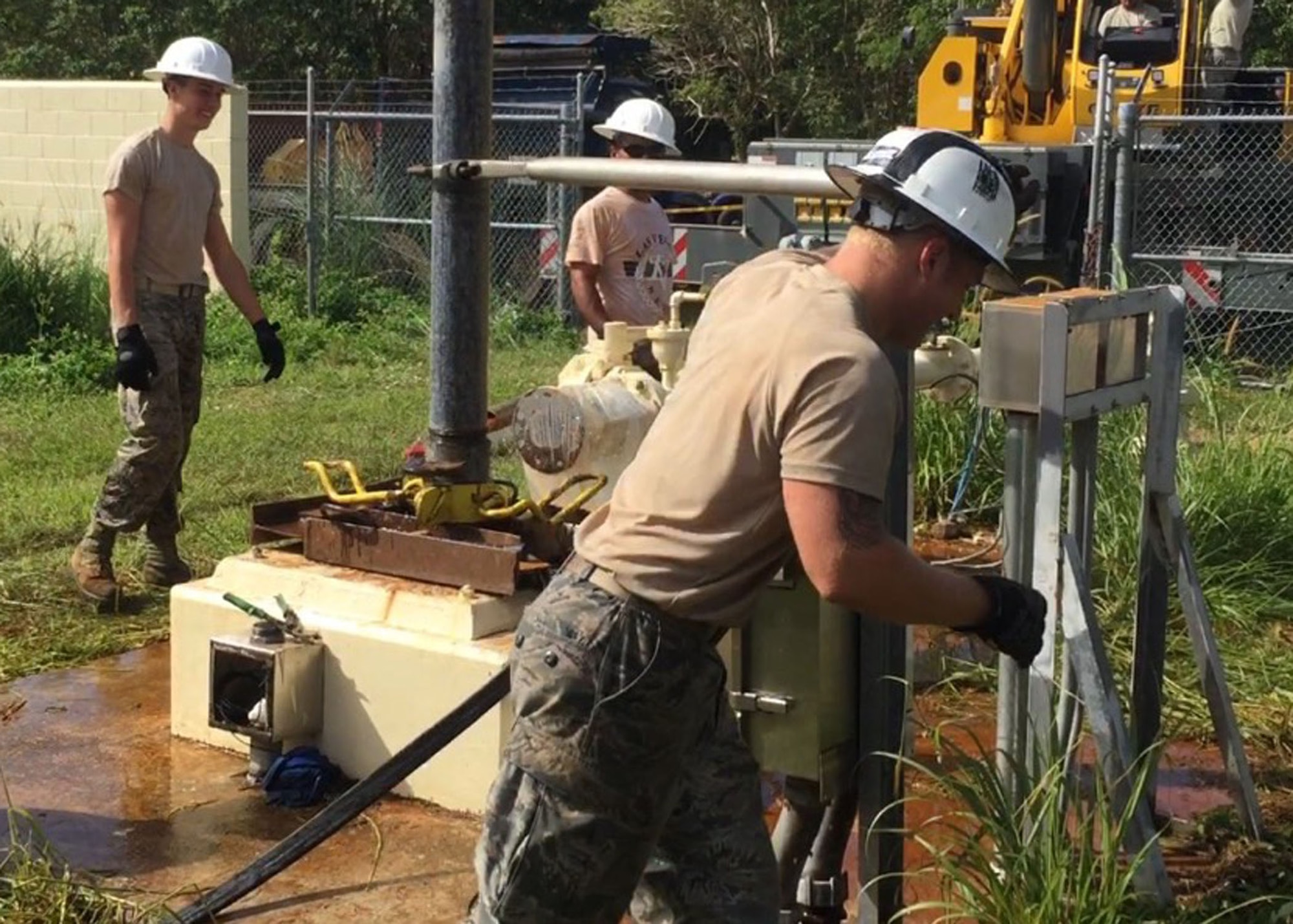 Airman 1st Class Nicholas Misseri (left) and Staff Sgt. Daniel Propper (right), 36th Civil Engineer Squadron water and fuels systems maintainers, replace a water well Feb. 2015 at Northwest Field, Guam. It is up to the water and fuel systems maintenance Airmen to not only maintain 45 miles of fuel pipeline and 100,000 miles of water lines, but also inspect and maintain 13 water wells that produce over 800 million gallons annually. (Courtesy photo)