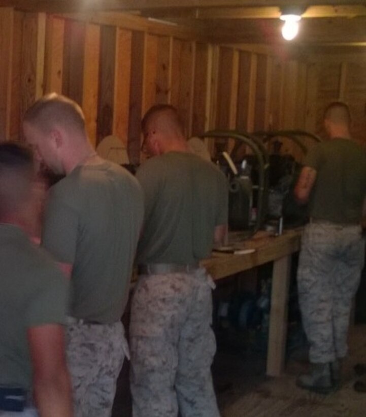 Marines from BWST 6-15 learn about repairing pumps through practical application.