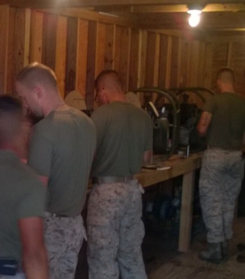 Marines from BWST 6-15 learn about repairing pumps through practical application.