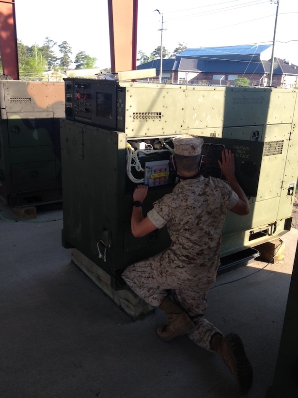 A Marine from BEEEST 6-15 learns about generator operations through practical application.