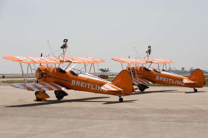 Two Boeing Stearman aircraft with the Breitling Wingwalkers sit at the flightline aboard Marine Corps Air Station Iwakuni, Japan, May 1, 2015. The Breitling Wingwalkers are slated to perform during the Japan Maritime Self-Defense Force/MCAS Iwakuni Friendship Day 2015 Air Show, May 3, 2015. This year the event expanded to combine both the JMSDF’s Fleet Air Wing 31’s annual Open House and the traditional MCAS Iwakuni Friendship Day, resulting in the first-ever joint Friendship Day air show. The event allows visitors a chance to see the military installation and interact with Japanese and American service members while enjoying aerial performances and static displays.
