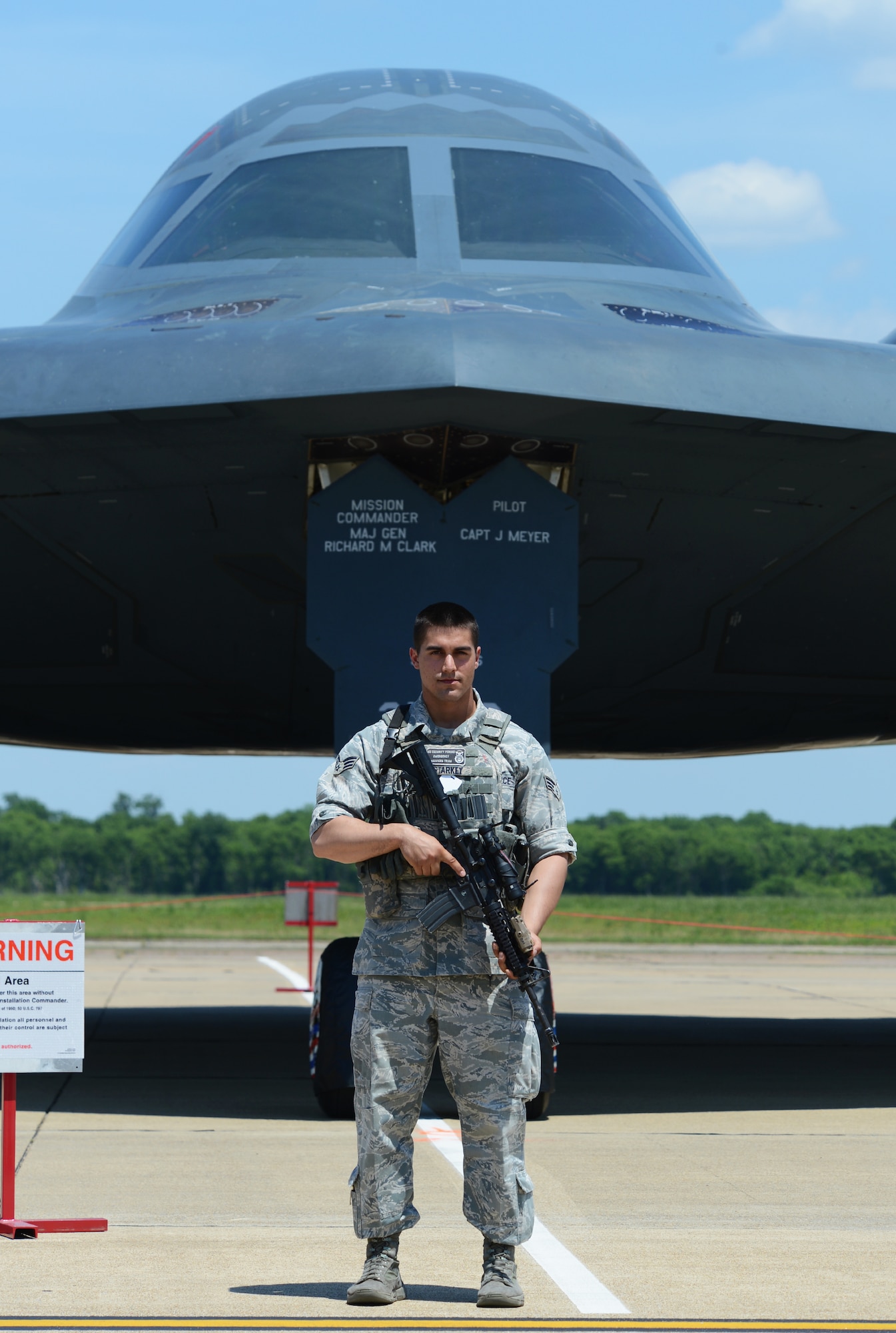 Senior Airman Timothy Starkey, 2nd Security Forces Squadron, guards a B-2 Spirit from Whiteman Air Force Base, Missouri, during the 2015 Defenders of Liberty Air Show at Barksdale Air Force Base, Louisiana, May 2. The B-2 Spirit is a multi-role bomber capable of delivering both conventional and nuclear munitions. The B-2 brings massive firepower to bear, in a short time, anywhere on the globe through previously impenetrable defenses. (U.S. Air Force photo/Senior Airman Benjamin Gonsier)