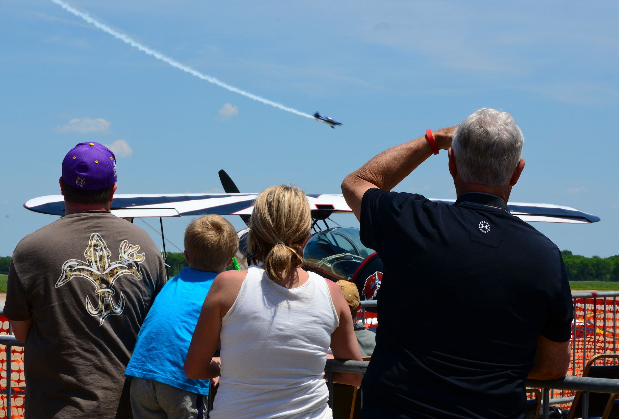 Spectators watch an air demonstration during the 2015 Defenders of Liberty Air Show at Barksdale Air Force Base, Louisiana, May 2. More than 60,000 people attended the air show to watch the demonstrations, view static displays of aircraft, and more. (U.S. Air Force photo/Senior Airman Benjamin Raughton)