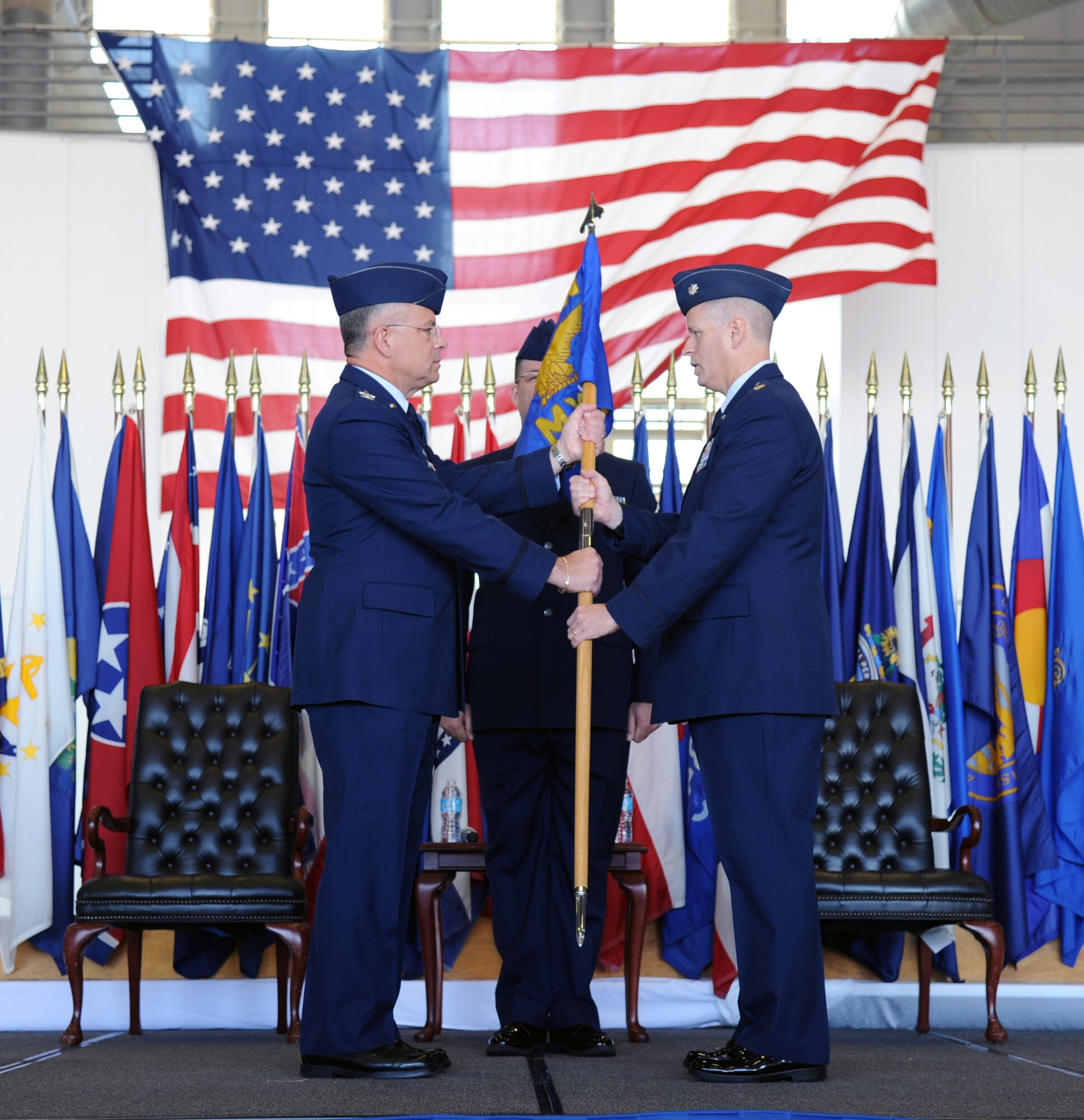 Lieutenant Colonel Kelly L. Bailey assumed command of the 927th Maintenance Group in an assumption of command ceremony held here, May 2. On left Col. Randal Bright, 927 ARW commander, passes the 927th MXG guidon to Lt. Col. Kelly Bailey. (U.S. Air Force photo/Tech. Sgt. Peter Dean)