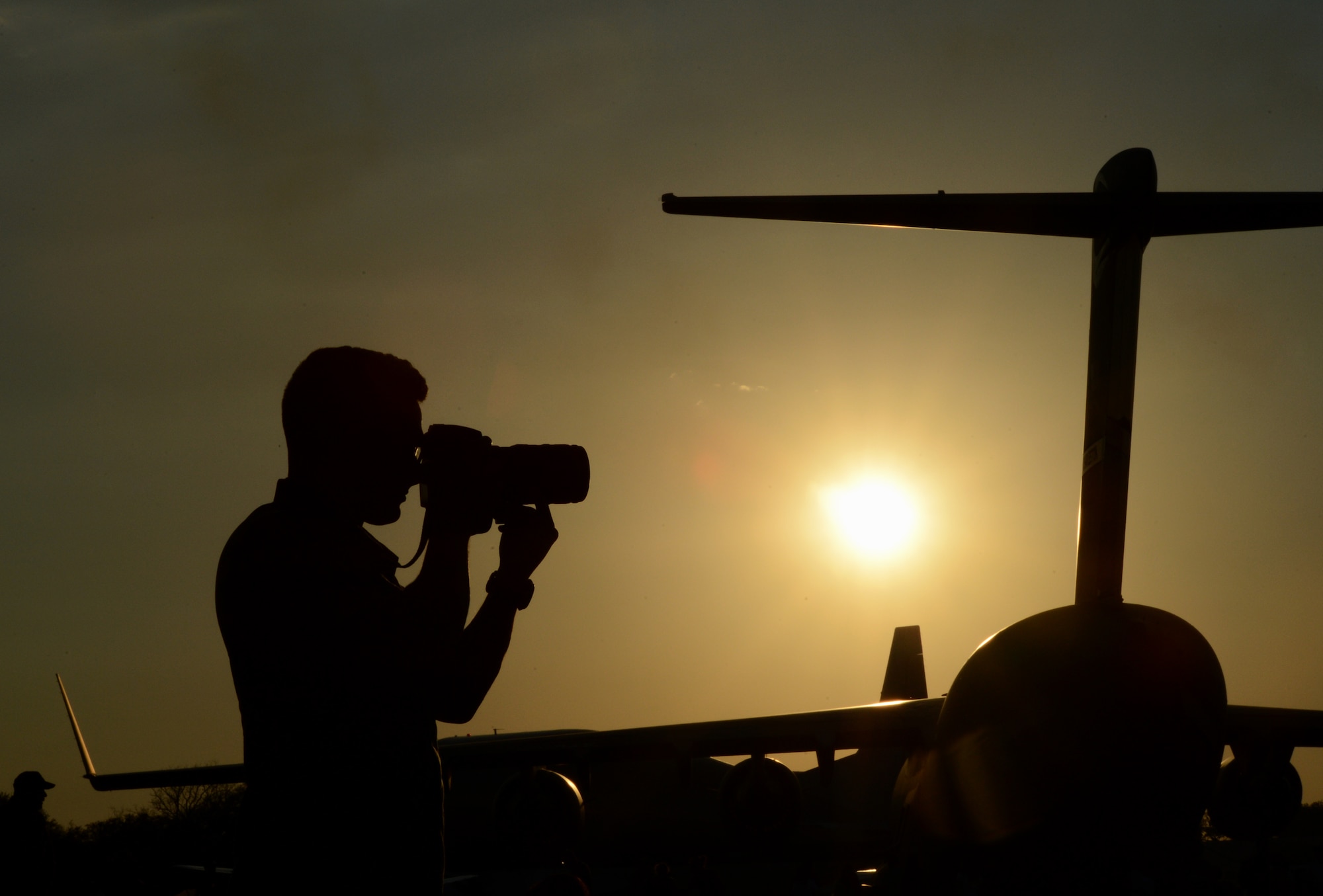 Senior Airman Joseph A. Pagán Jr., 2nd Bomb Wing Public Affairs photojournalist, photographs an aerial demonstration during the 2015 Defenders of Liberty Air Show at Barksdale Air Force Base, Louisiana, May 1. The mission of 2nd BW Public Affairs is to maintain positive relationships through the flow of information from wing leadership to our internal and external audiences and to provide innovative, state-of-the-art, multimedia services and public affairs support to the 2nd Bomb Wing and its mission partners. (U.S. Air Force photo/Senior Airman Benjamin Gonsier)
