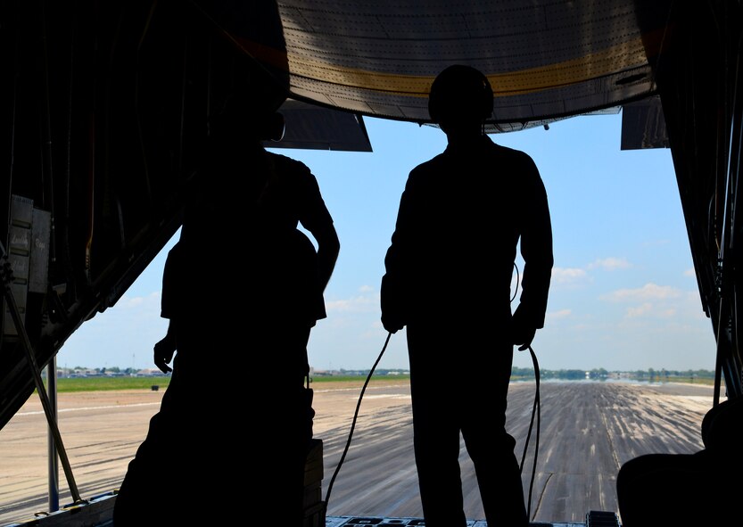 Aircrew of the U.S. Navy Flight Demonstration Team Blue Angels' C-130 Hercules, Fat Albert, prepare for arrival after the aircraft lands on the runway during the 2015 Defenders of Liberty Air Show at Barksdale Air Force Base, Louisiana, May 1. Fat Albert provided flights for Airmen and media crews during the 2015 Defenders of Liberty Air Show. (U.S. Air Force photo/Senior Airman Benjamin Raughton)