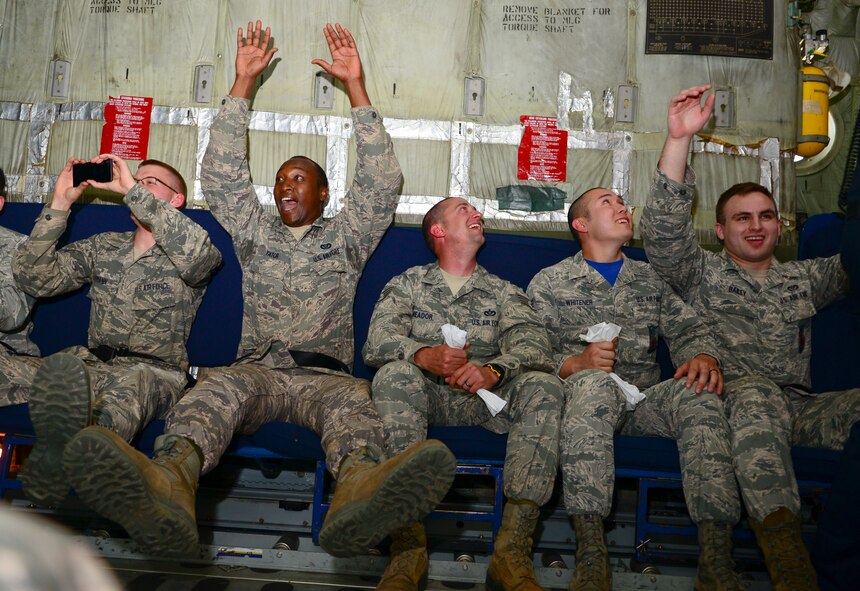 Airmen experience weightlessness on the U.S. Navy Flight Demonstration Team Blue Angels' C-130 Hercules, Fat Albert, during the 2015 Defenders of Liberty Air Show at Barksdale Air Force Base, Louisiana, May 1. Fat Albert and the Blue Angels are the headlining act for the 2015 Defenders of Liberty Air Show. (U.S. Air Force photo/Senior Airman Benjamin Raughton)  