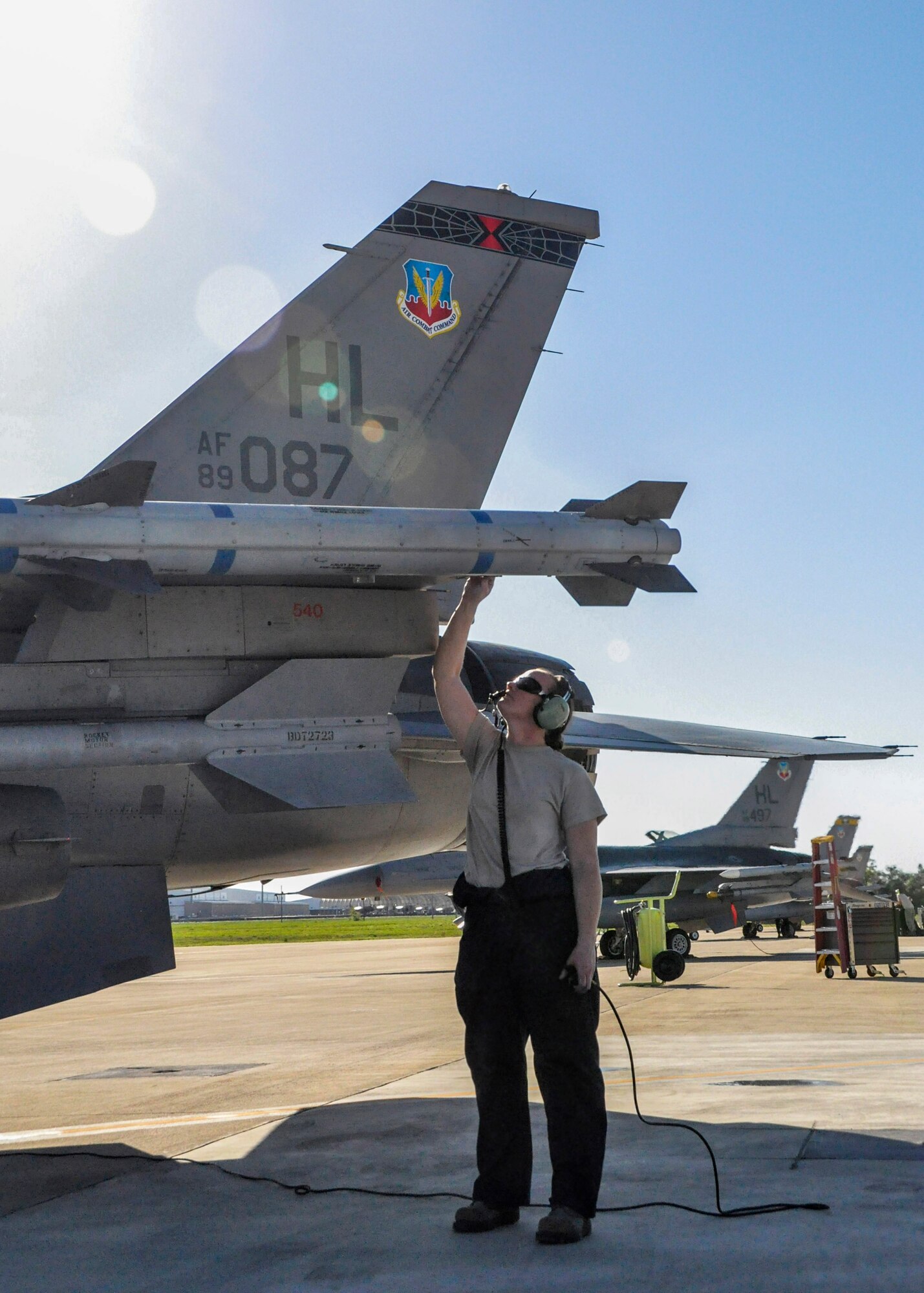 Staff Sgt. Heather Halti, 419th Aircraft Maintenance Squadron crew chief, examines the equipment on an F-16 minutes before takeoff during Emerald Warrior at Eglin Air Force Base, Fla. Nearly 300 personnel from Hill’s fighter wings are deployed here to provide combat air support during the two-week special operations training exercise. (U.S. Air Force photo/Staff Sgt. Crystal Charriere)