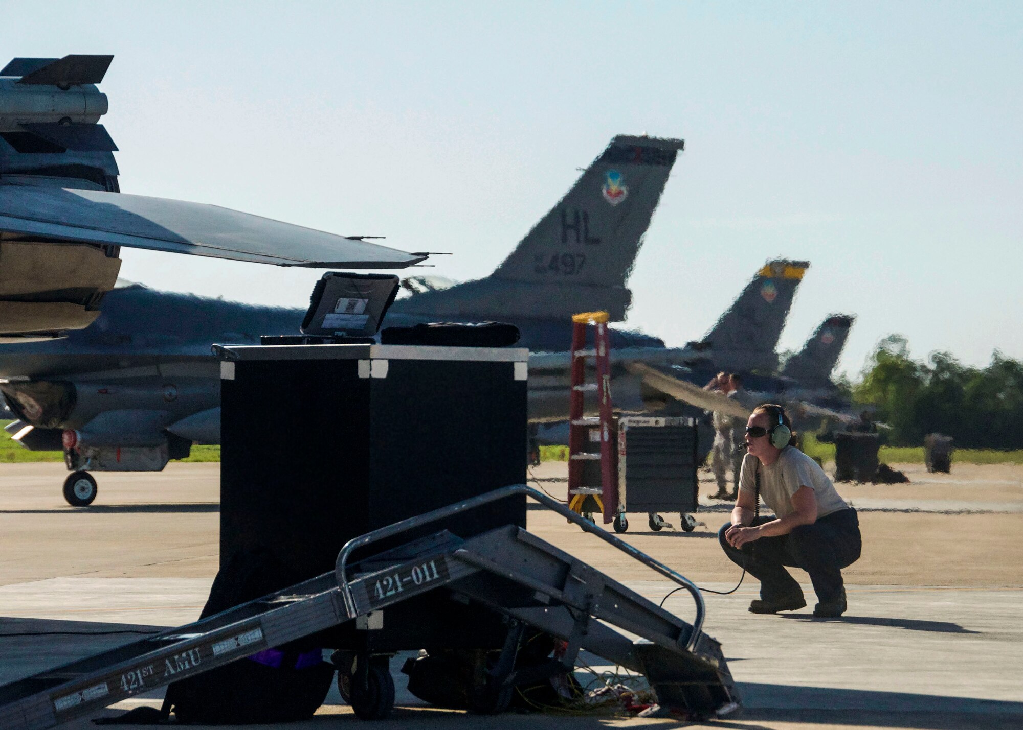 Staff Sgt. Heather Halti, 419th Aircraft Maintenance Squadron crew chief, stands by as 1st Lt. Sean Rush, an active duty F-16 pilot with the 388th Fighter Wing, runs through pre-flight checks before takeoff. Nearly 300 personnel from Hills fighter wings are deployed here to provide combat air support during the two-week special operations training exercise. (U.S. Air Force photo/Staff Sgt. Crystal Charriere)