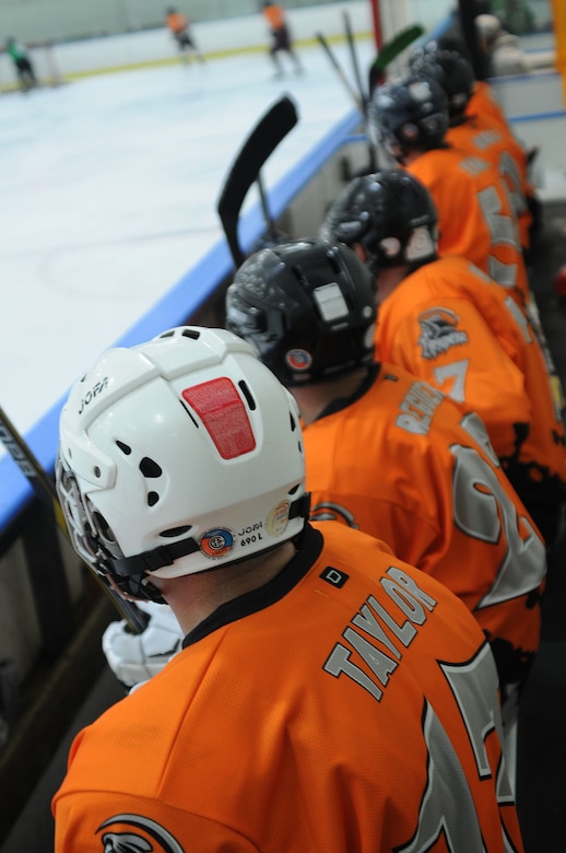 Players of the Horsham Reapers hockey team, established at Horsham Air Guard Station, Pennsylvania, watch fellow players while waiting to take the ice at Ice Line Quad Rinks, April 25, 2015, in West Chester, Pennsylvania. The lineup is mostly comprised of Guardsmen and family members from the 111th Attack Wing at Horsham AGS, but also includes a former Pa. Army National Guardsman. (U.S. Air National Guard photo by Tech. Sgt. Andria Allmond/Released)