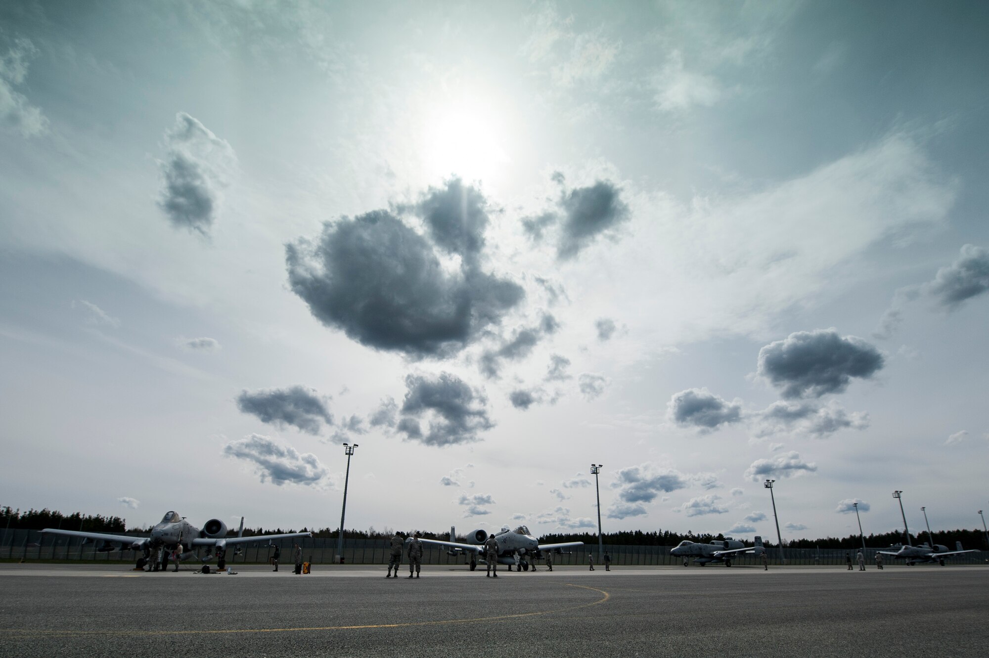 A-10 Thunderbolt II attack aircraft are marshaled to their parking spots on the flightline, May 1, 2015, at Ämari Air Base, Estonia. The aircraft will forward deploy to locations in Eastern European NATO countries as part of the theater TSP.  (U.S. Air Force photo by Senior Airman Rusty Frank/Released)
