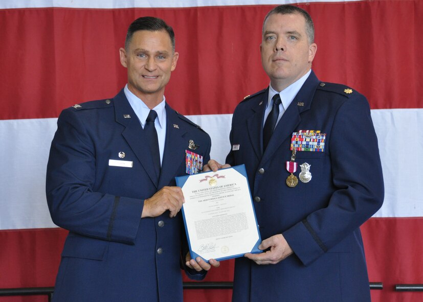 Major Robert Mays II, 94th Security Forces Squadron operations officer, receives the Meritorious Service Medal Award second oak leaf cluster from Colonel Brett Clark, 94th Airlift Wing commander, at Dobbins Air Reserve Base, Ga, May 2. Mays received the award for outstanding performance and leadership as the officer in charge of the 94th AW Commander’s Action Group. (U.S. Air Force photo/ Senior Airman Miles Wilson)
