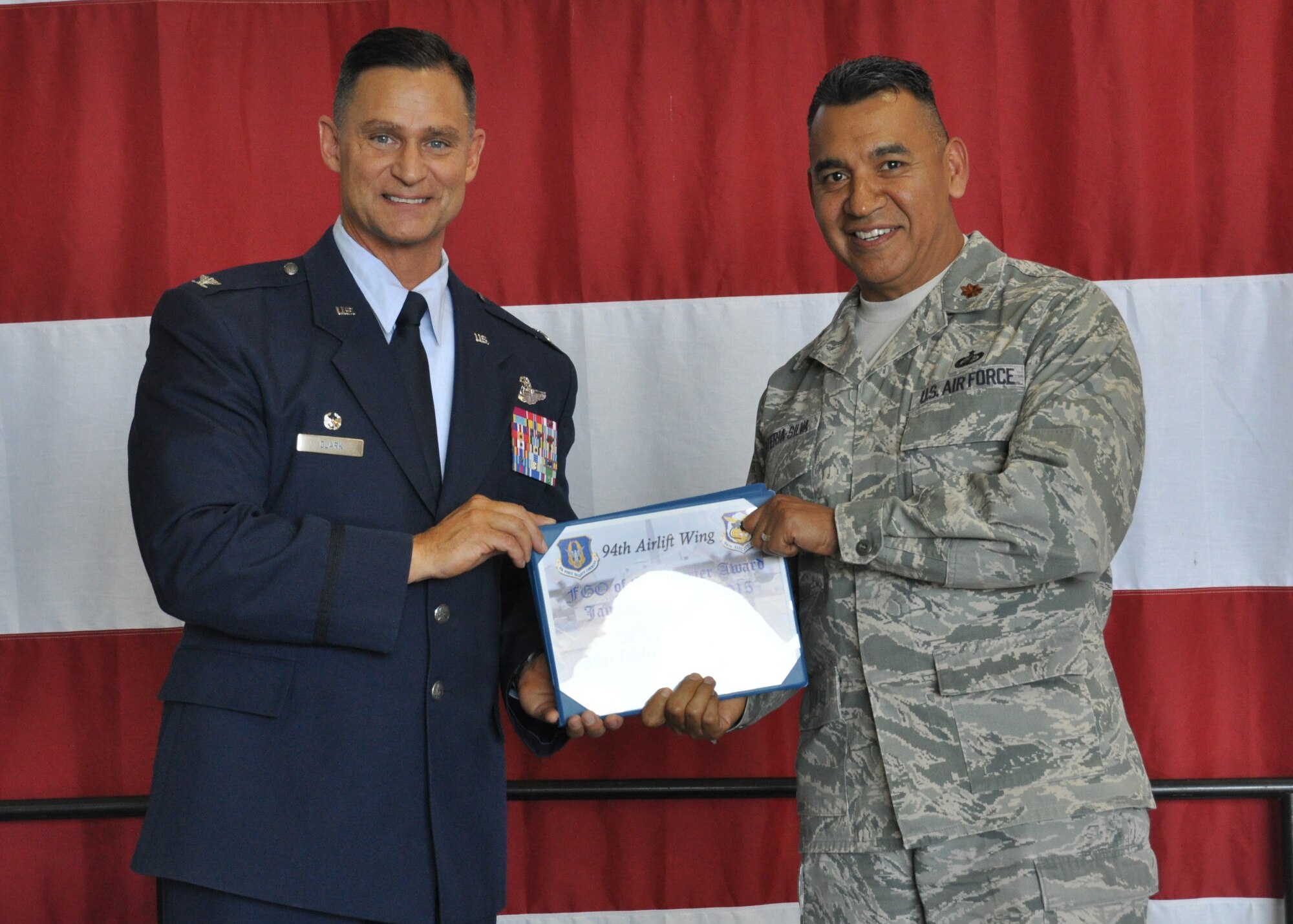 Major Isidro Renteria-Silva, of the 94th Airlift Wing Financial Management Office, receives the 2015 first quarter field grade officer of the quarter award at Dobbins Air Reserve Base, Ga, May 2. Renteria-Silva was one of many distinguished individuals to be recognized at the May unit training assembly Commander’s Call. (U.S. Air Force photo/ Senior Airman Miles Wilson)