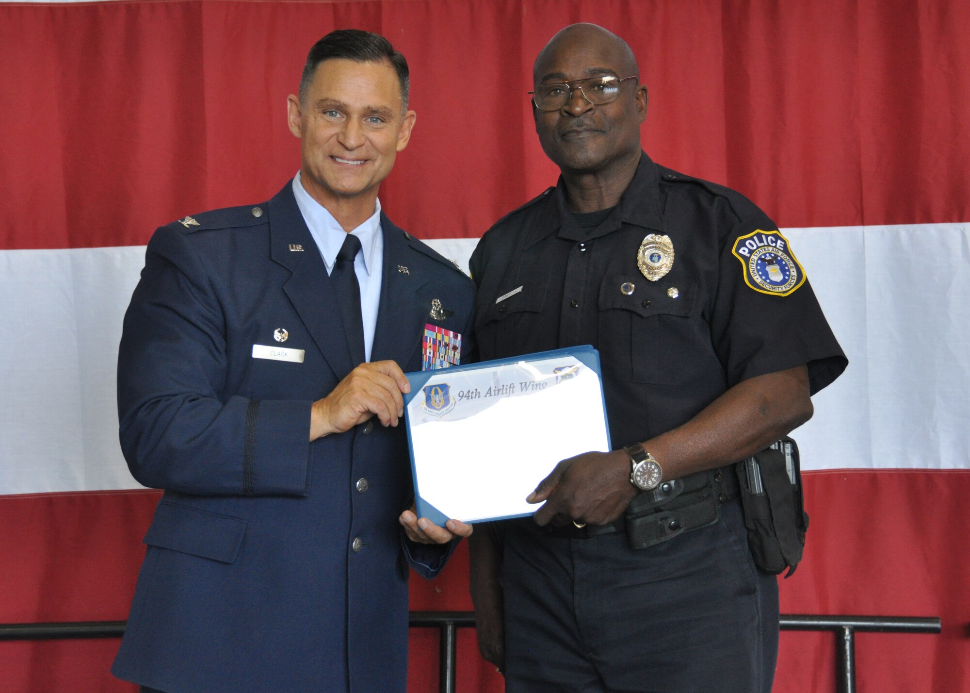 Arthur Griffith, of the 94th security Forces Squadron, receives the 2015 first quarter non-supervisory civilian of the quarter award at Dobbins Air Reserve Base, Ga, May 2. Griffith was one of many distinguished individuals to be recognized at the May unit training assembly Commander’s Call. (U.S. Air Force photo/ Senior Airman Miles Wilson)