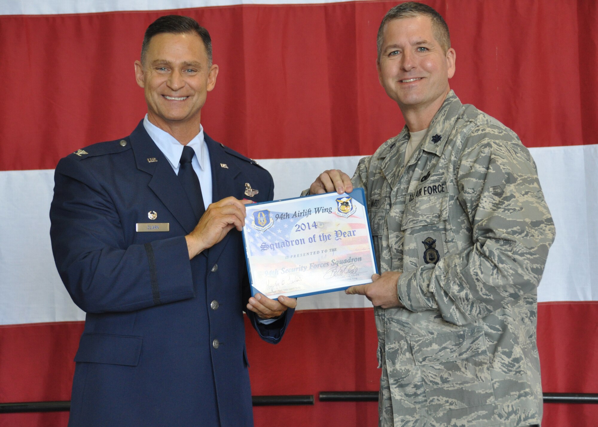 Lieutenant Colonel Timothy Martz, 94th Security Forces Squadron commander, receives the 2014 Squadron of the Year Award for the 94th SFS at Dobbins Air Reserve Base, Ga, May 2. The 94th SFS was recognized for its achievements during 2014. (U.S. Air Force photo/ Senior Airman Miles Wilson)