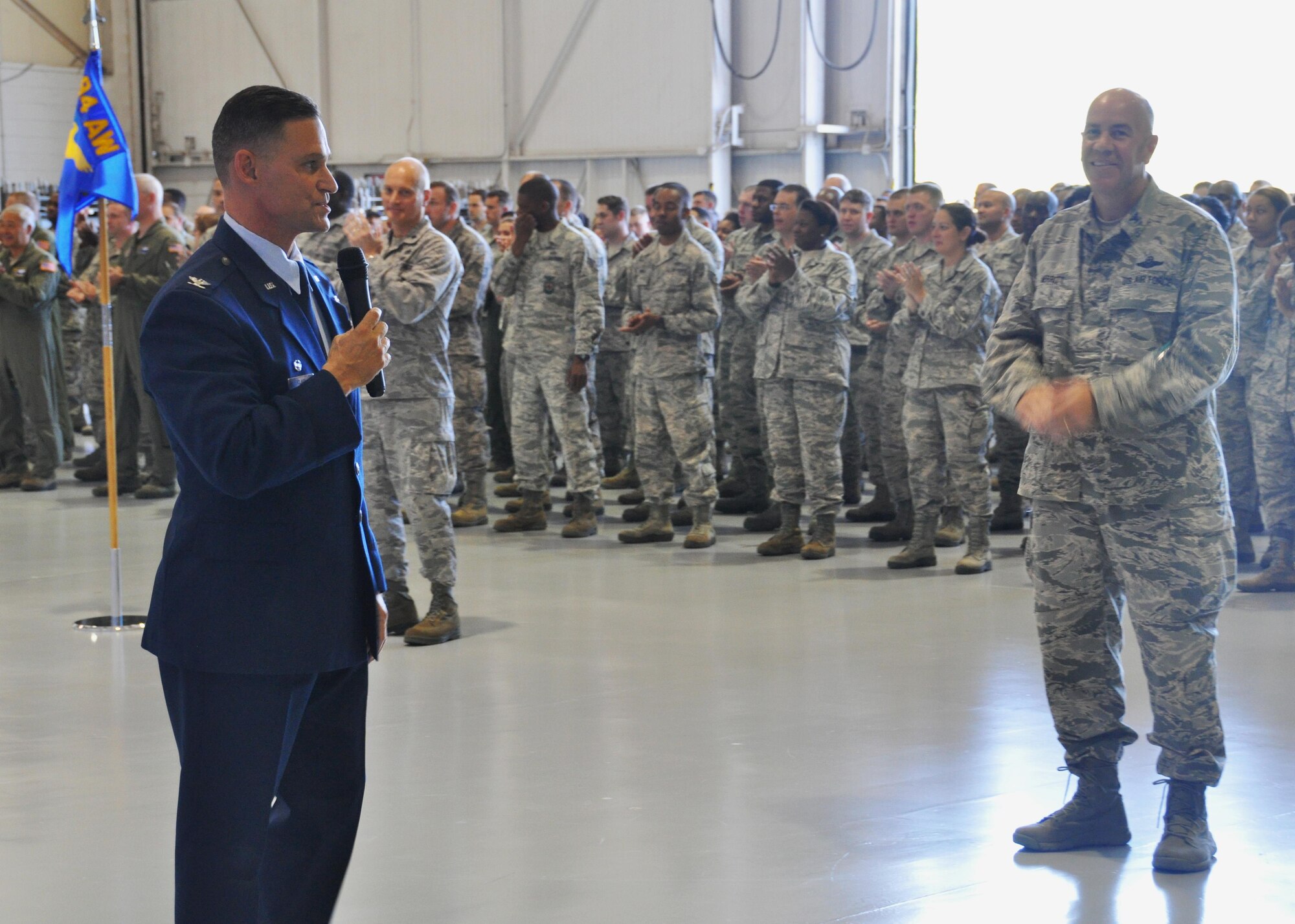 Colonel Brett Clark, 94th Airlift Wing commander, gives a briefing to the 94th AW at Dobbins Air Reserve Base, Ga, May 2. Clark was speaking at his last Commander’s Call at Dobbins, before he retires in November. (U.S. Air Force photo/ Senior Airman Miles Wilson)