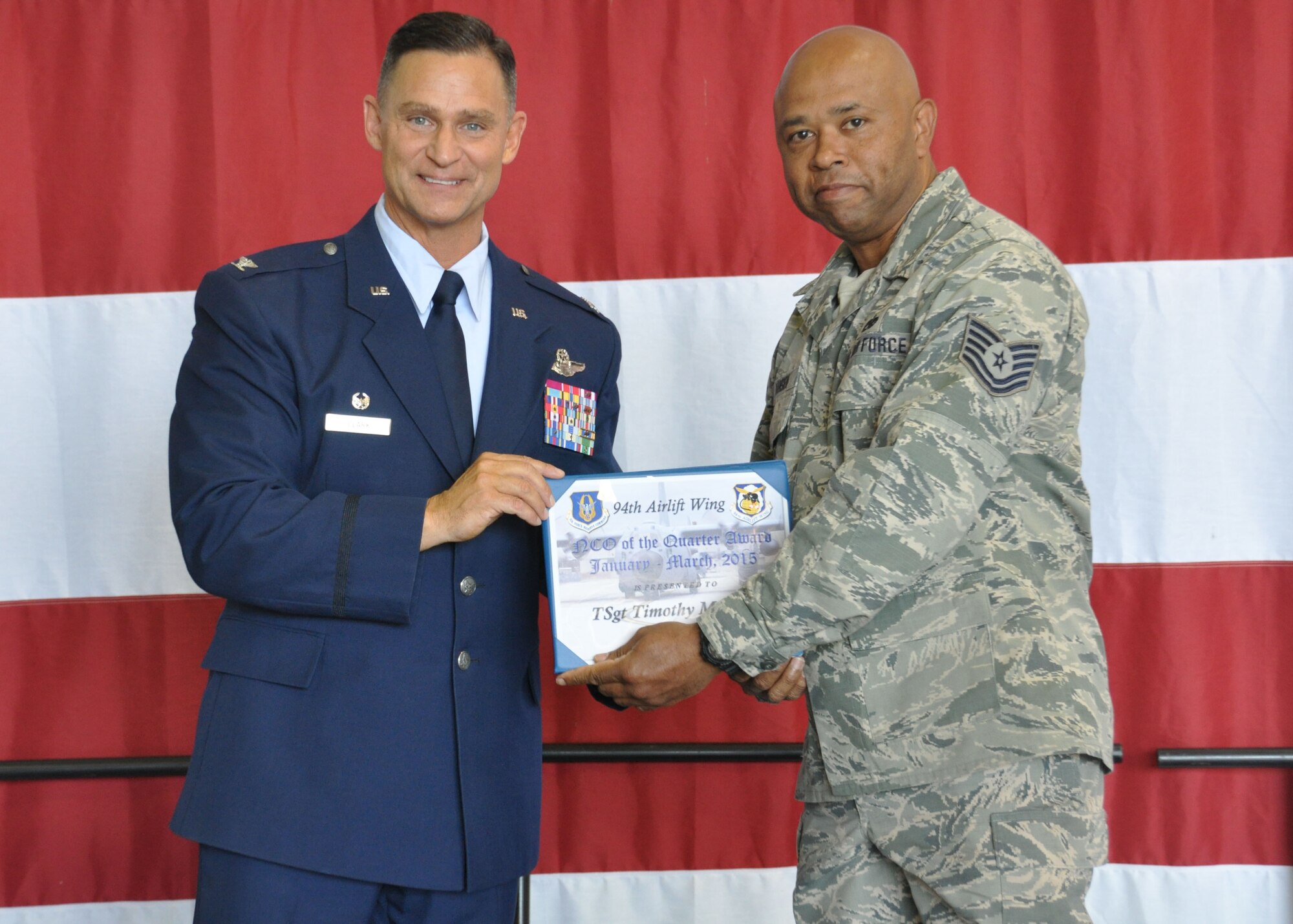 Technical Sgt. Timothy Mansion, of the 94th Aircraft Maintenance Squadron, receives the 2015 first non-commissioned officer of the quarter award at Dobbins Air Reserve Base, Ga, May 2. Mansion was one of many individuals to be recognized at the Commander’s Call that day. (U.S. Air Force photo/ Senior Airman Miles Wilson)