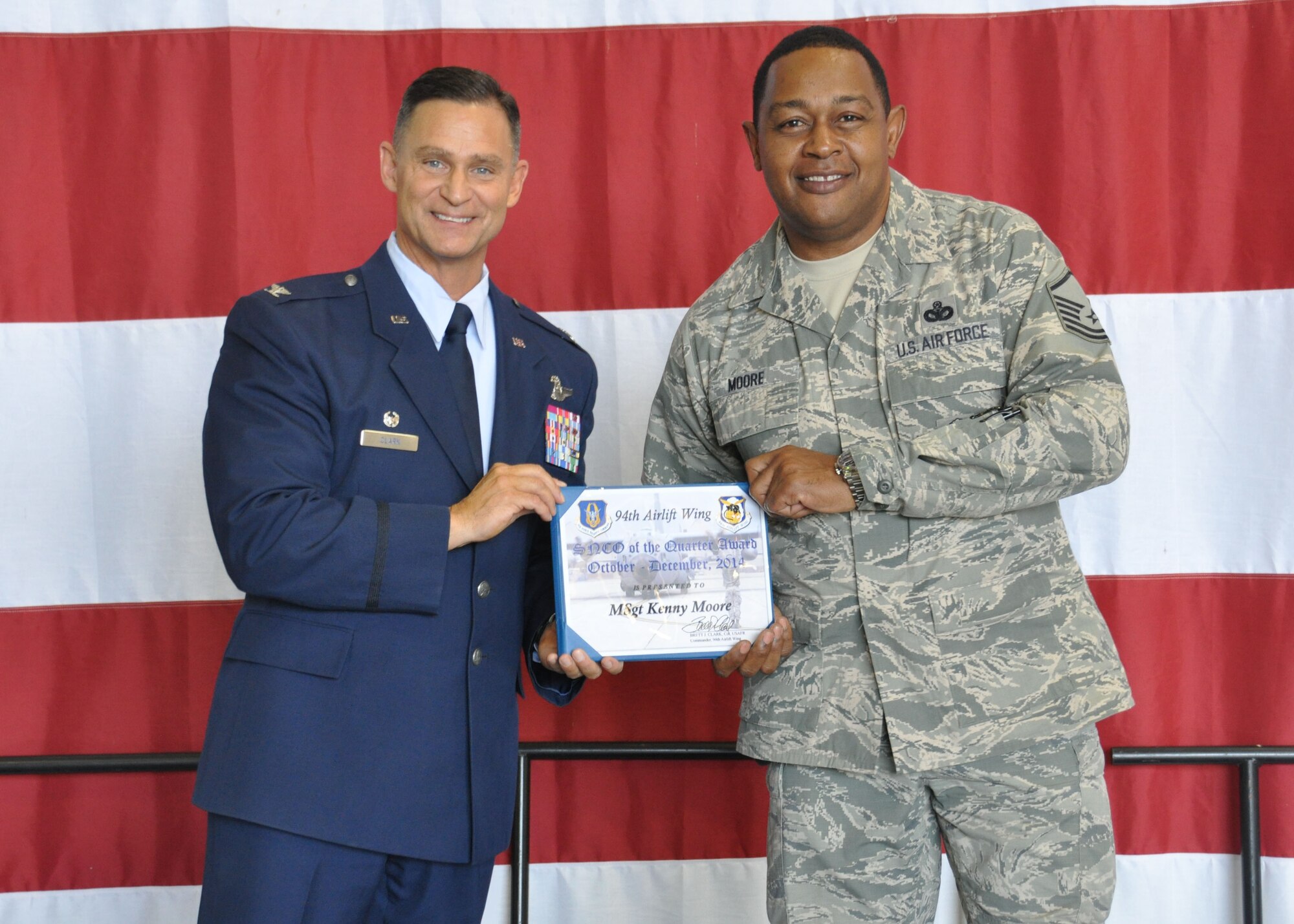 150502-F-NN480-021
Master Sgt. Kenny Moore, 94th Security Forces Squadron flight sergeant, receives the 2014 fourth quarter senior non-commissioned officer award at Dobbins Air Reserve Base, Ga, May 2. Moore was one of many individuals to be recognized at the Commander’s Call that day. (U.S. Air Force photo/ Senior Airman Miles Wilson)
