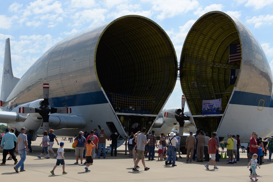 Spectators admire the unique hinged nose of a NASA B-377 Super Guppy during the 2015 Defenders of Liberty Airshow at Barksdale Air Force Base, Louisiana, May 2. The Super Guppy has a cargo compartment that is 25 feet tall, 25 feet wide and 111 feet long. It can carry a maximum payload of more than 26 tons. (U.S. Air Force photo/Airman 1st Class Curt Beach)
