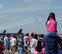 Spectators watch the U.S. Navy Flight Demonstration Team Blue Angels F/A-18 Hornets fly by during the 2015 Defenders of Liberty Airshow at Barksdale Air Force Base, Louisiana, May 2. The mission of the Blue Angels is to showcase the pride and professionalism of the United States Navy and Marine Corps by inspiring a culture of excellence and service to country through flight demonstrations and community outreach. (U.S. Air Force photo/Airman 1st Class Curt Beach)
