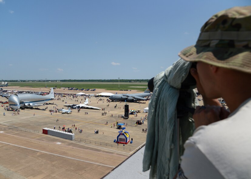 Senior Airman Steven Mucker, 2nd Security Forces Squadron emergency services team designated marksman, looks for a missing child during the 2015 Defenders of Liberty Airshow on Barksdale Air Force Base, Louisiana, May 3. Mucker assisted more than five families find their missing child among the thousands of people attending the show. (U.S. Air Force photo/Senior Airman Joseph A. Pagán Jr.)