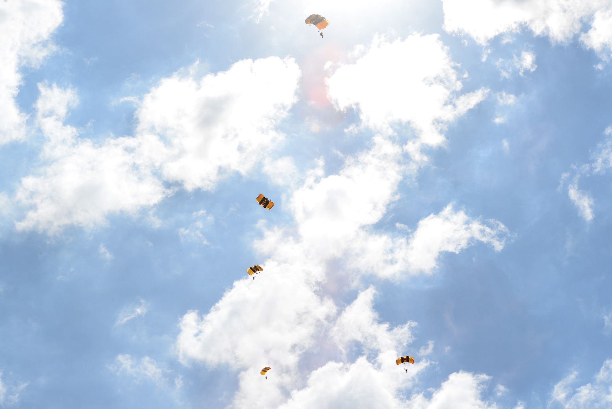 Members of the U.S. Army Parachute Team "Golden Knights" soar through the sky as one of the premier acts of the 2015 Defenders of Liberty Airshow at Barksdale Air Force Base, Louisiana, May 2. The Golden Knights portray the image of being the most formidable parachuting competitors and demonstrators in the world today. (U.S. Air Force photo/Airman 1st Class Curt Beach)