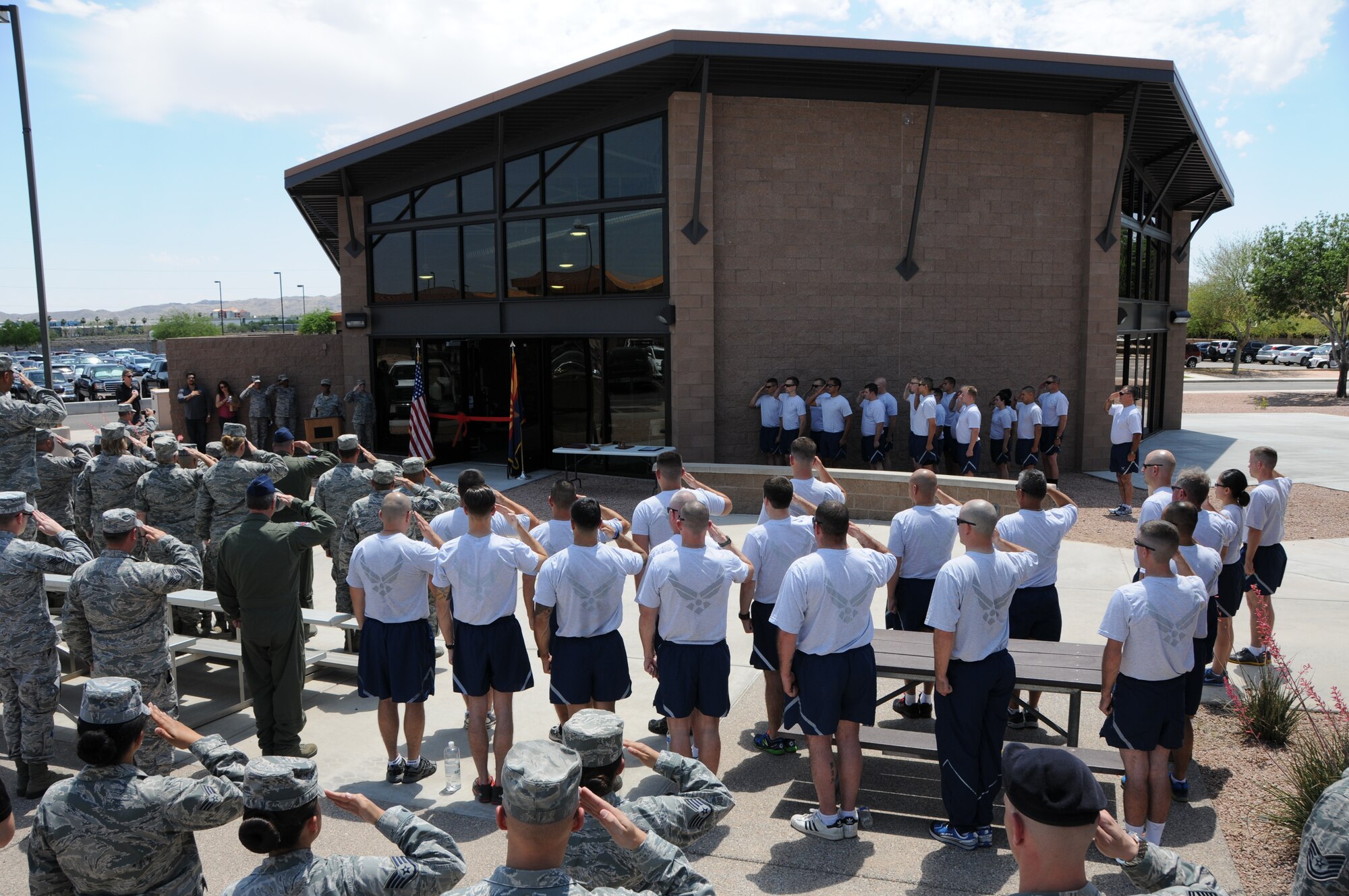 Airmen of the 161st Air Refueling Wing gather for a ribbon cutting ceremony for the wing’s new fitness center at the Phoenix Air National Guard base, May 2. At 2,400 square-feet, the first ever stand-alone fitness center to be built on an Air National Guard base after the base’s original construction will accommodate nearly twice as many Airmen as the old facility. (U.S. Air National Guard photo by Tech. Sgt. Courtney Enos)