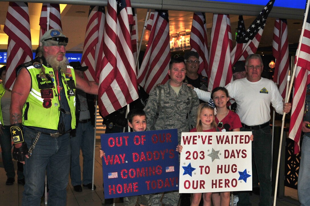 Master Sgt. Matthew Bauer is welcomed home by his family and the Freedom Riders at Phoenix Sky Harbor International Airport, May 2, 2015.  Seventeen members from the 161st Security Forces Squadron returned home after spending six months deployed to Southwest Asia.  (U. S. Air National Guard photo by Master Sgt. Kelly M. Deitloff))