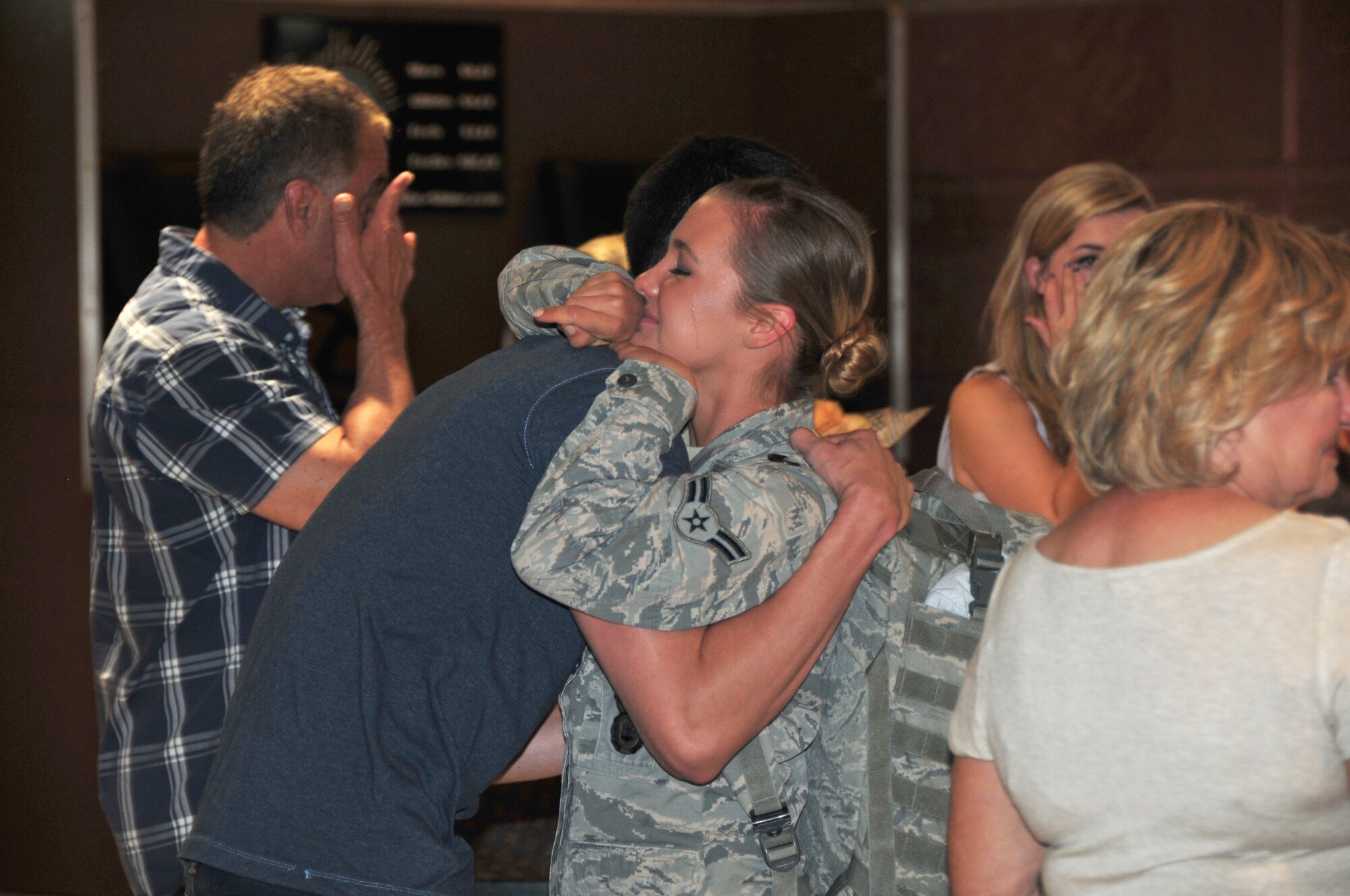 Airman 1st Class Madison Green is welcomed home by her family at Phoenix Sky Harbor International Airport, May 2, 2015.  Seventeen members from the 161st Security Forces Squadron returned home after spending six months deployed to Southwest Asia.  (U. S. Air National Guard photo by Master Sgt. Kelly M. Deitloff)