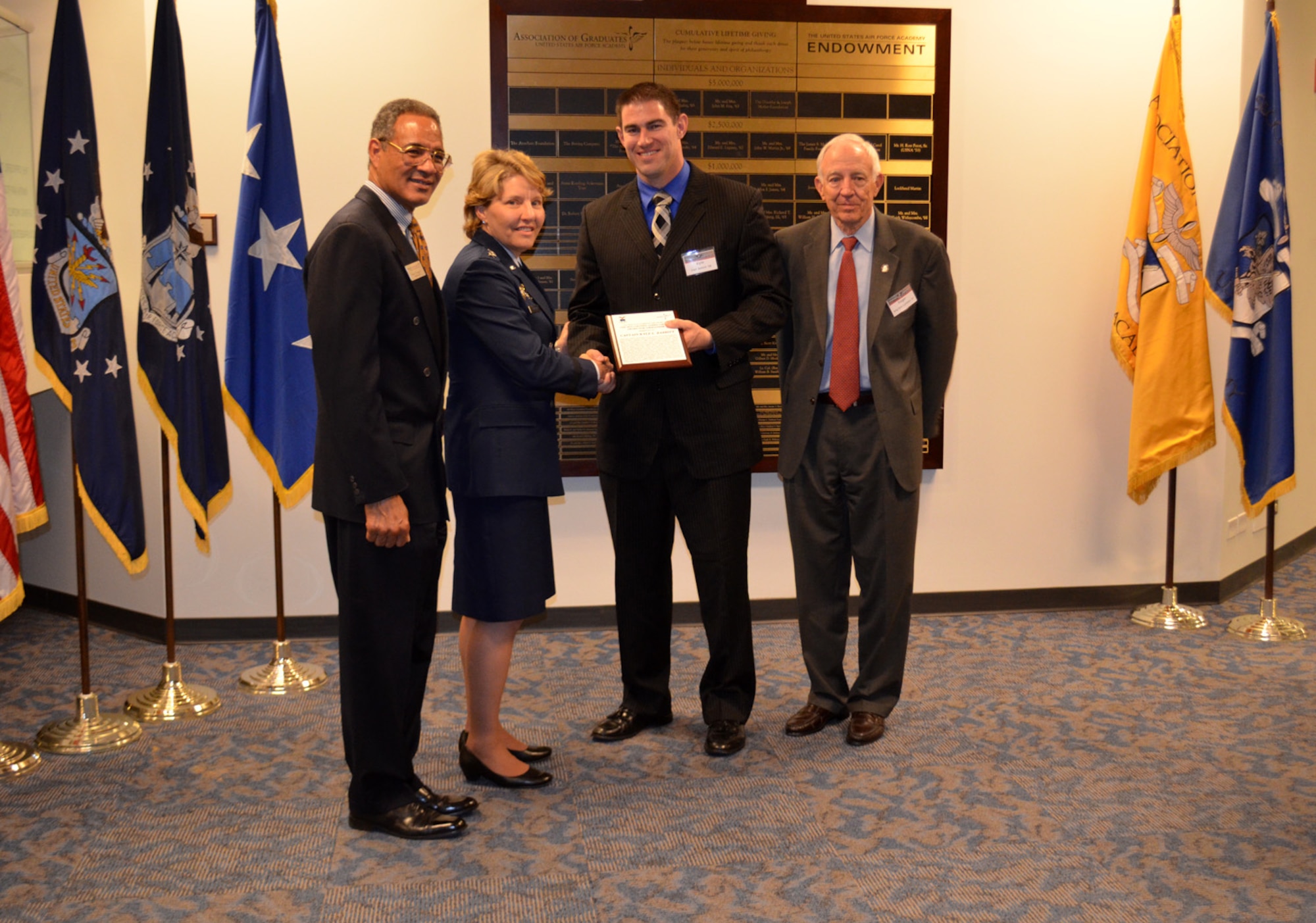 Capt. Kyle Babbit, 303d Fighter Squadron A-10 Thunderbolt II pilot, accepts The Jabara Award for Airmanship, at the Air Force Academy May 1. Babbitt earned this award for his hard work and dedication down range between September 2013 and October 2014. (U.S. Air Force photo by Capt. Denise Haeussler)