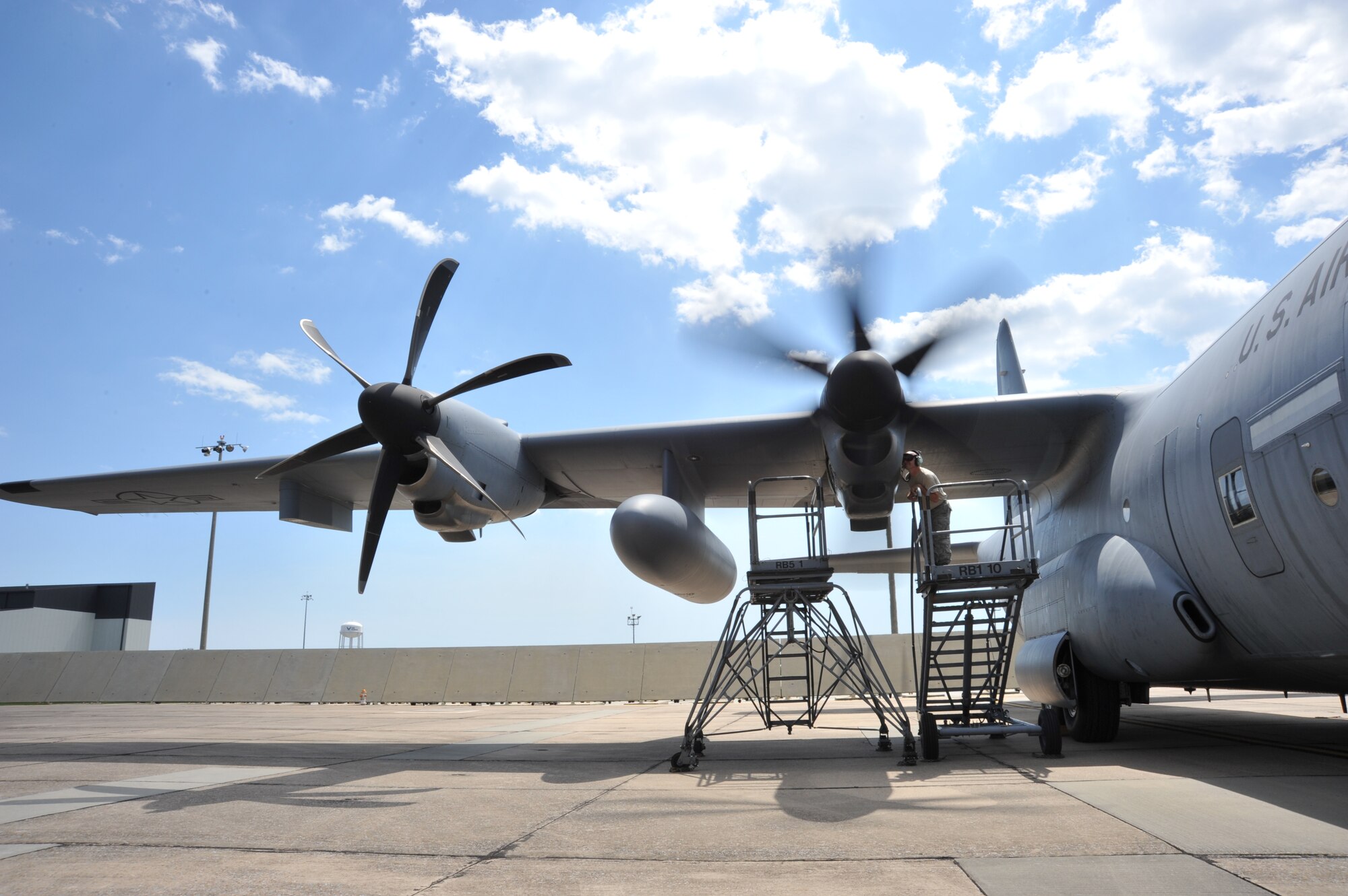 Tech. Sgt. Ronnie Graham, 403rd Maintenance Squadron jet engine craftsman, checks a WC-130J engine for an oil leak May 1, 2015. The mechanics have to check for bleed air leaks while the engine is running to locate the oil leak. (U.S. Air Force photo/Maj. Marnee A.C. Losurdo)