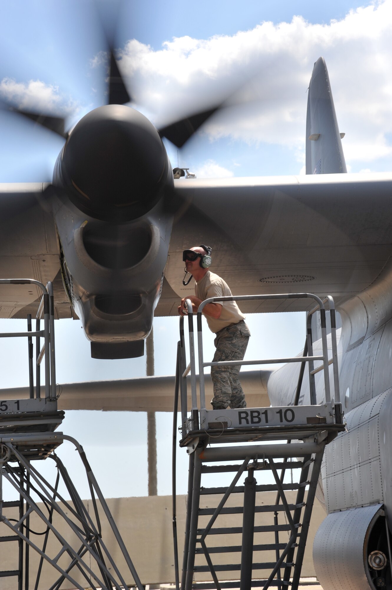 Tech. Sgt. Ronnie Graham, 403rd Maintenance Squadron jet engine craftsman, checks a WC-130J engine for an oil leak May 1, 2015. The mechanics have to check for bleed air leaks while the engine is running to locate the oil leak. (U.S. Air Force photo/Maj. Marnee A.C. Losurdo)