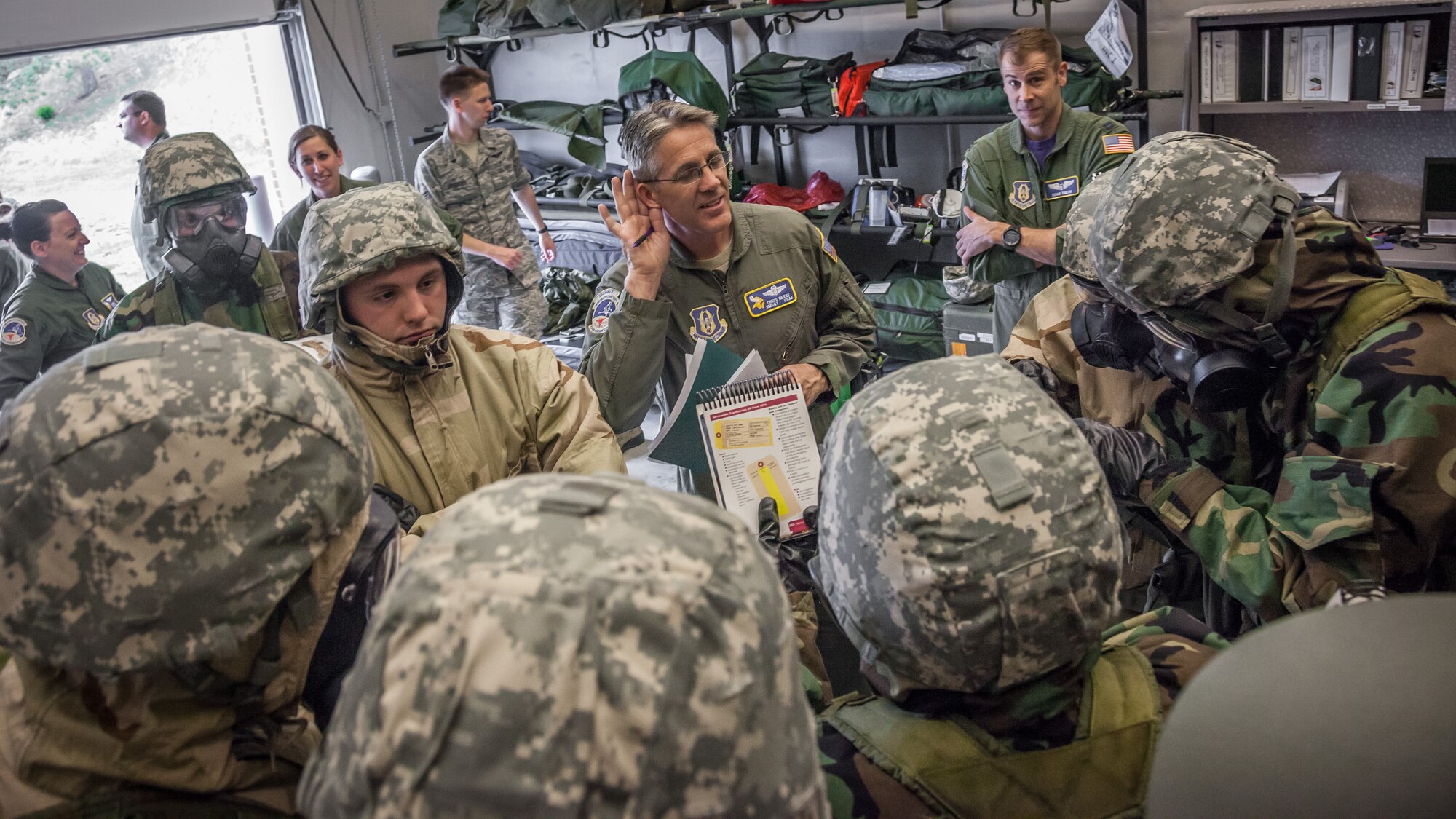Senior Master Sgt. Chris Reese, 934th Aeromedical Evacuation Squadron, listens for an answer as he quizzes Airmen during a Chemical, Biological, Radiological, Nuclear, and Explosives (CBRNE) challenge.  Members of the 934 AES brushed up on skills and competed in challenges during a block training session April 30 and May 1 at the Minneapolis-St. Paul Air Reserve Station, Minn.  (U.S. Air Force photo by Shannon McKay/Released)