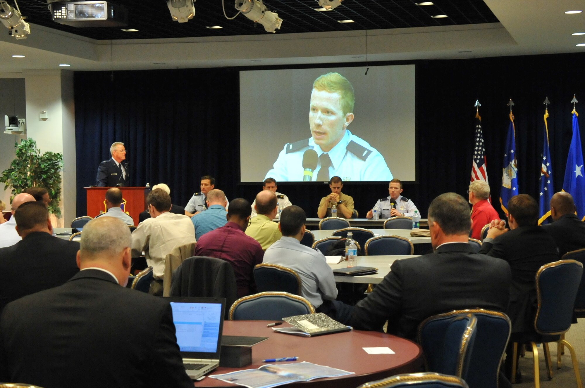 Attendees at the 2015 Global Positioning Systems Directorate Partnership Council listen to joint services testimonials at the Warfighter Panel and Discussion held at Los Angeles Air Force Base in El Segundo, Calif. GPS Directorate members and stakeholders interacted, viewed current and emerging technologies and engaged in discussing the year’s theme: “Modernization is Happening Now.” (U.S. Air Force photo by Tech. Sgt. Sarah Corrice/Released)