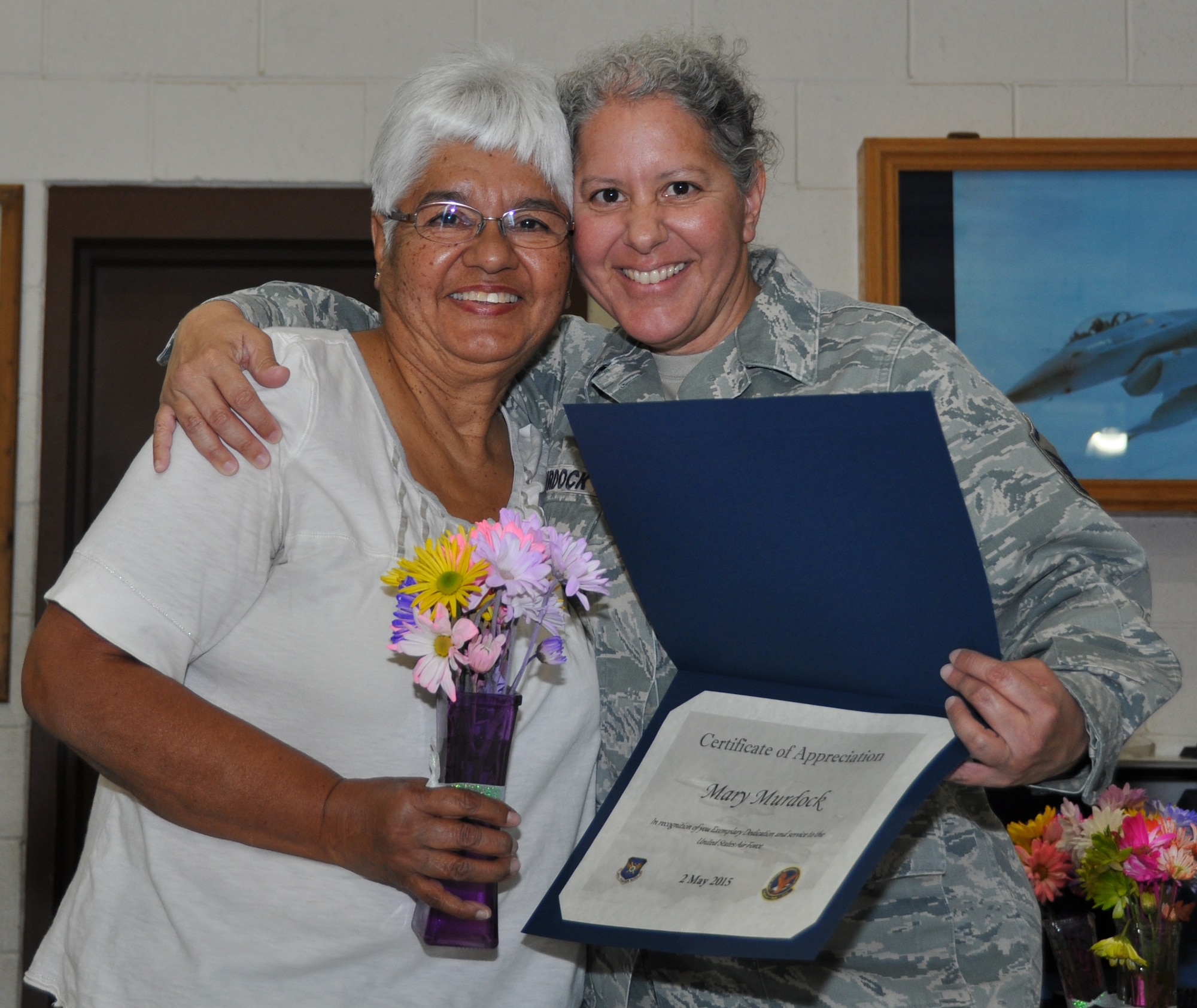 Master Sgt. Victoria Murdock, 301st Logistics Readiness Squadron NCOIC of decentralized materials support, honors her mom May 2 during a Mother's Day event at Naval Air Station Fort Worth Joint Reserve Base, Texas. Airmen and their families were provided lunch then family members honored their moms with flowers and certificates. The 301st Aircraft Maintenance Squadron Key Spouses organized the entire event. (U.S. Air Force photo/Staff Sgt. Melissa Harvey)