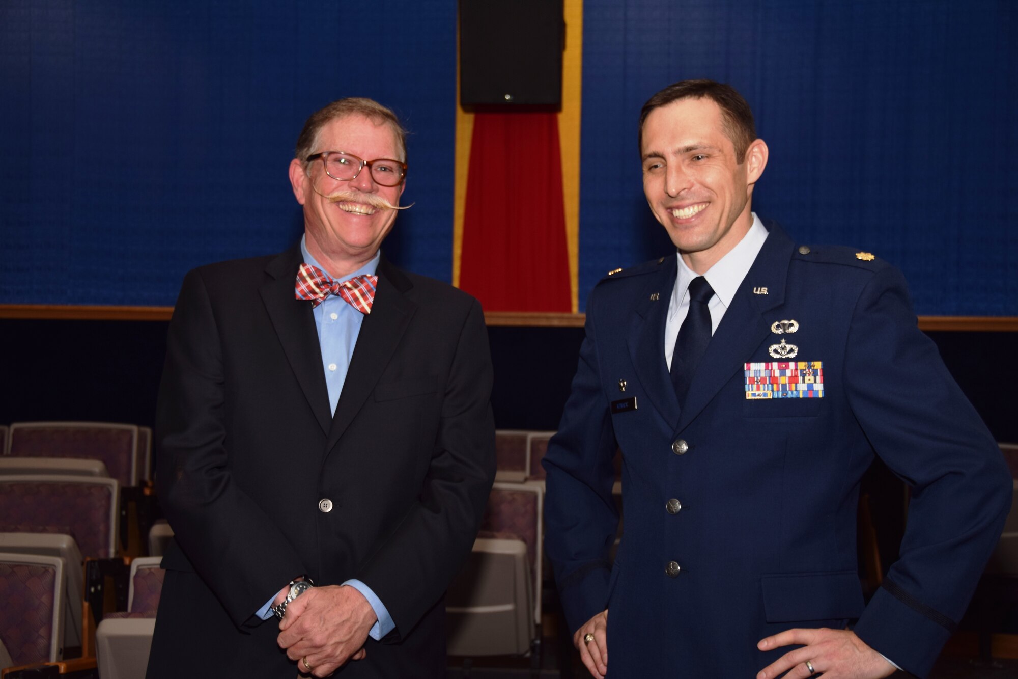 Steven Richmond, president and director of maintenance, Pizza Hut of San Antonio and Maj. Joshua Kovacic, commander, 433rd Civil Engineering Squadron, talk prior to the 433rd Airlift Wing’s Honorary Commanders Induction Ceremony, May 2, 2015 at Joint Base San Antonio-Lackland, Texas.  (U.S. Air Force Photo by Tech. Sgt. Carlos J. Trevino)


