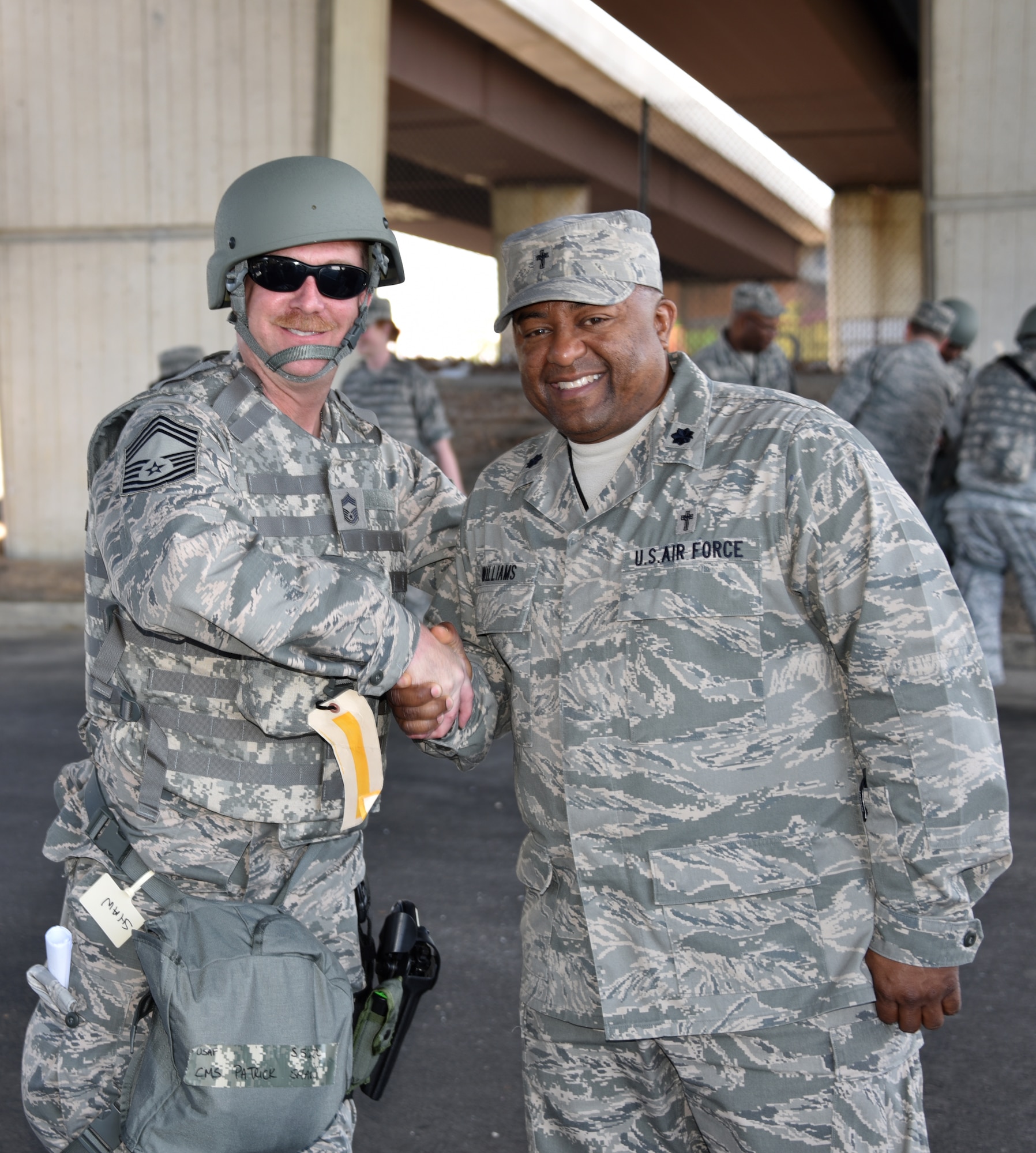Chief Master Sgt. Patrick Shaw, left, shakes hands with Lt. Col. Ivan Williams, 175th Wing chaplain on May 2.. Shaw is part of Operation Baltimore Rally who are in Baltimore during the state of emergency. (U.S. National Guard photo by  Senior Master Sgt. Ed Bard/RELEASED) 