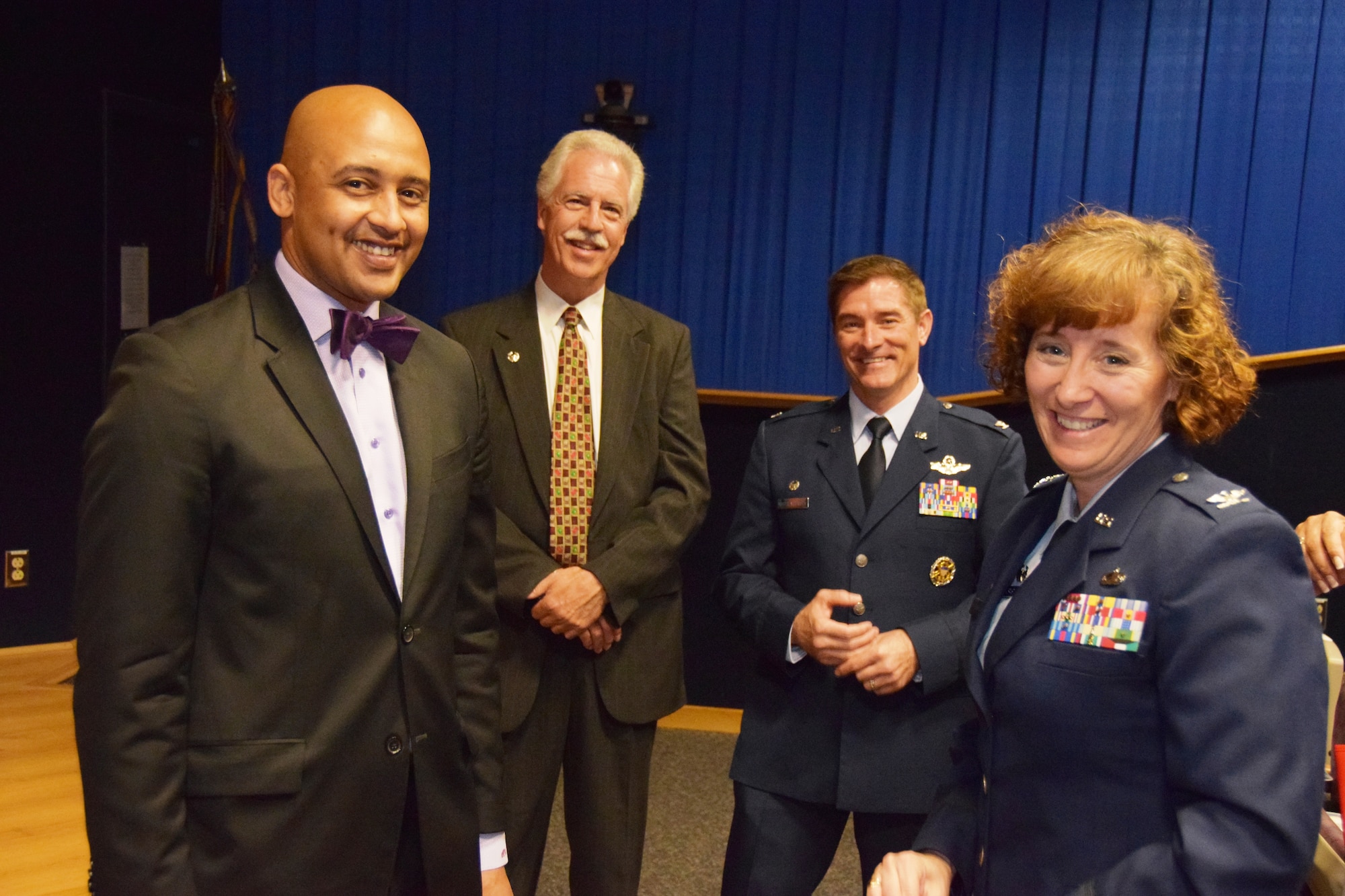 Alan Warrick, II, (left) City Councilman for District 2, Honorary Commander, Dave Saylor, Owner, Acadiana Café; Col. William W. Whittenberger, Jr. 433rd Airlift Wing commander and Col. Lisa Craig, commander, 433rd Mission Support Group talk prior to the 433rd Airlift Wing’s Honorary Commanders Induction Ceremony, May 2, 2015 at Joint Base San Antonio-Lackland, Texas. (U.S. Air Force Photo by Tech. Sgt. Carlos J. Trevino)