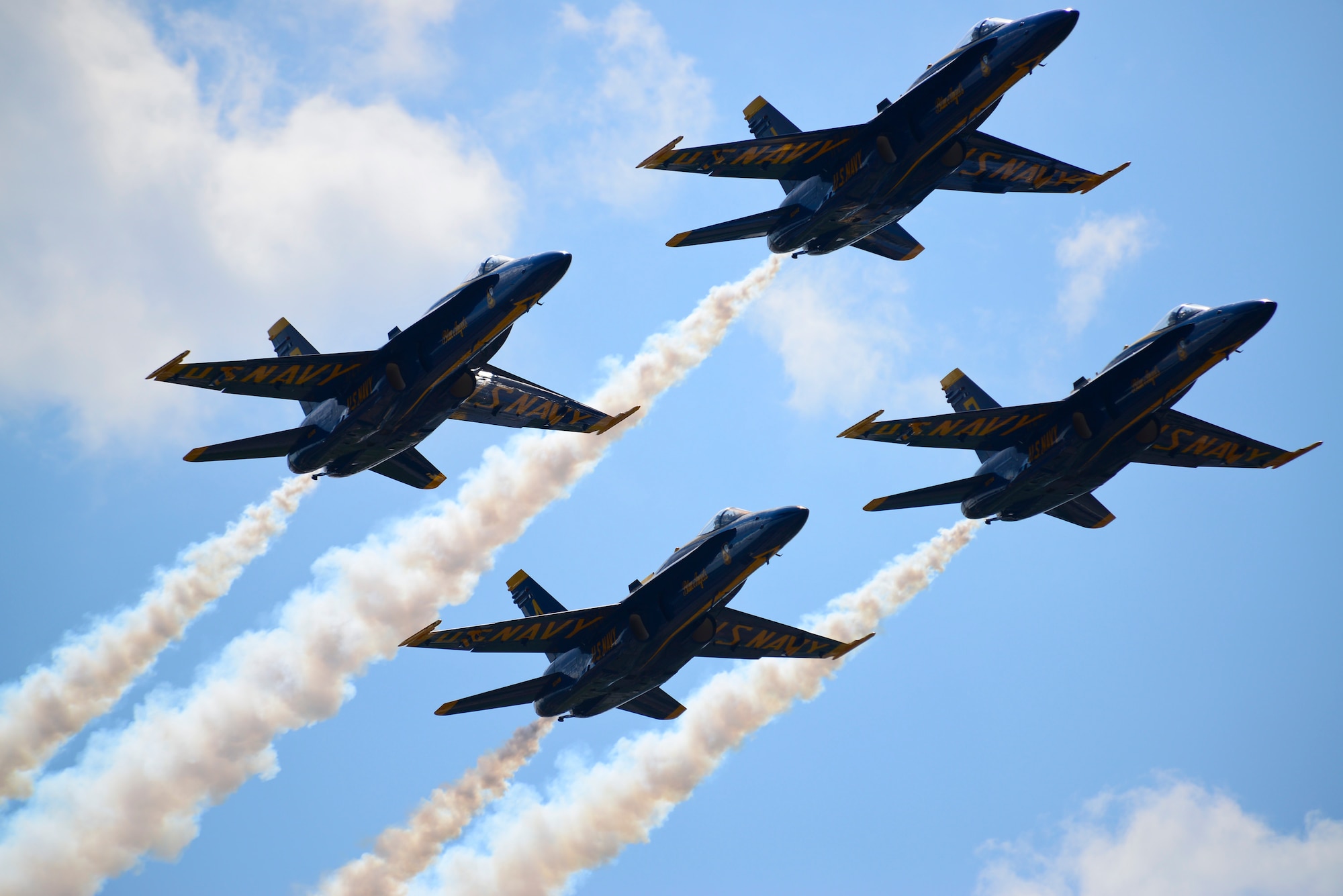 The U.S. Navy Flight Demonstration Team Blue Angels F/A-18 Hornets perform Low Break Cross aerial maneuver during the 2015 Defenders of Liberty Air Show at Barksdale Air Force Base, Louisiana, May 2. The Blue Angels reach an estimated 11 million spectators during air shows each year. (U.S. Air Force photo/Senior Airman Benjamin Raughton)