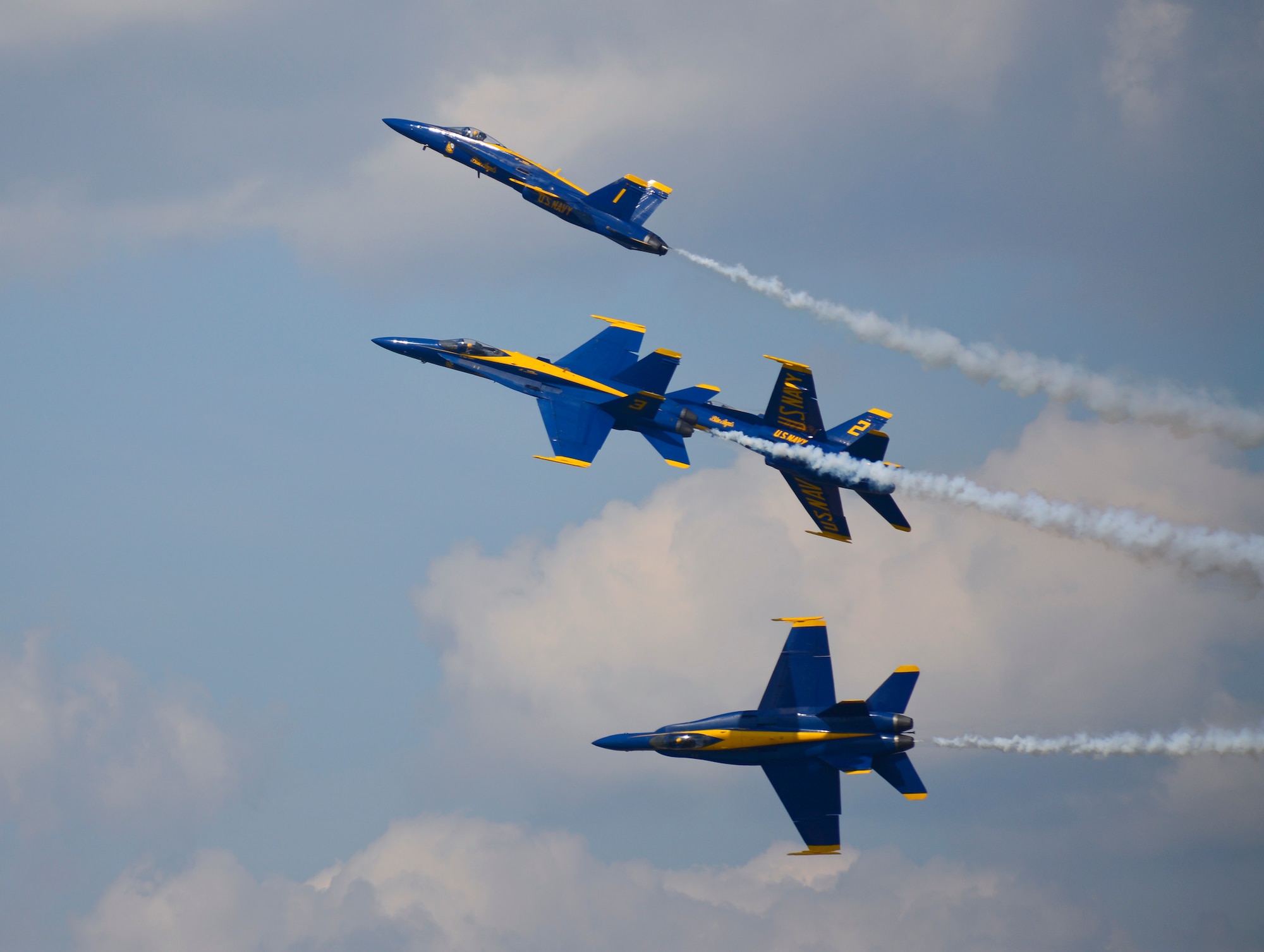The U.S. Navy Flight Demonstration Team Blue Angels F/A-18 Hornets perform the Barrel Roll Break aerial maneuver during the 2015 Defenders of Liberty Air Show at Barksdale Air Force Base, Louisiana, May 2. The Blue Angels reach an estimated 11 million spectators during air shows each year. (U.S. Air Force photo/Senior Airman Benjamin Raughton)