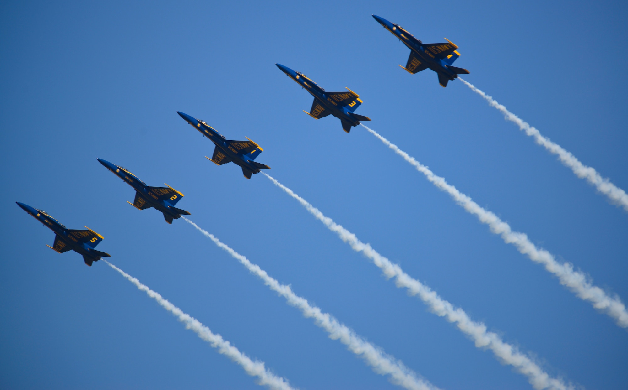 The U.S. Navy Flight Demonstration Team Blue Angels F/A-18 Hornets perform the Line Abreast Loop aerial maneuver during the 2015 Defenders of Liberty Air Show at Barksdale Air Force Base, Louisiana, May 2. The Blue Angels first air show was at Craig Field, Jacksonville, Florida, June 15, 1946. (U.S. Air Force photo/Senior Airman Benjamin Raughton)