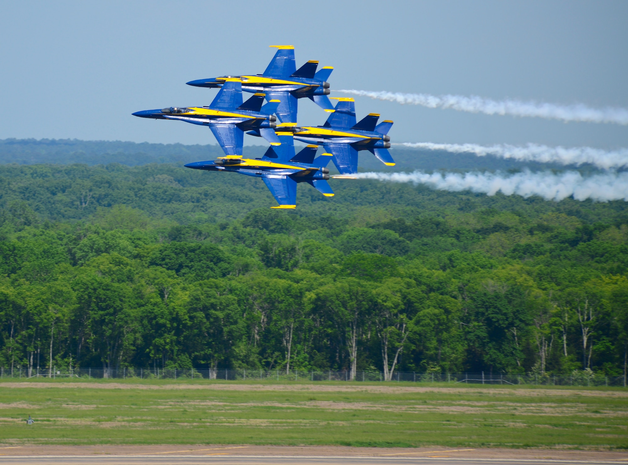 The U.S. Navy Flight Demonstration Team Blue Angels F/A-18 Hornets perform the Diamond 360 aerial maneuver during the 2015 Defenders of Liberty Air Show at Barksdale Air Force Base, Louisiana, May 2. The Blue Angels first air show was at Craig Field, Jacksonville, Florida, June 15, 1946. (U.S. Air Force photo/Senior Airman Benjamin Raughton)